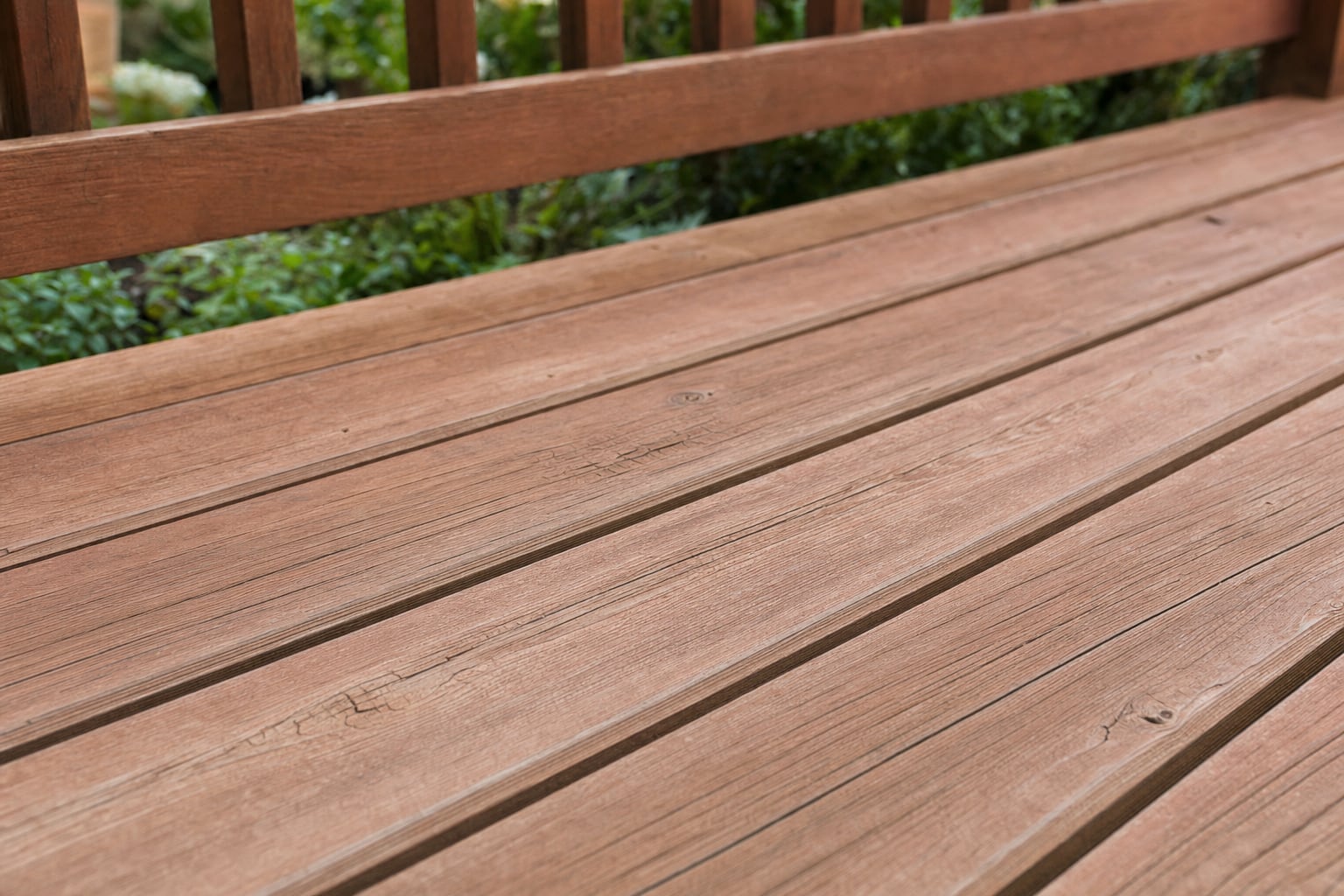 Weathered exterior wood with visible sun and moisture exposure