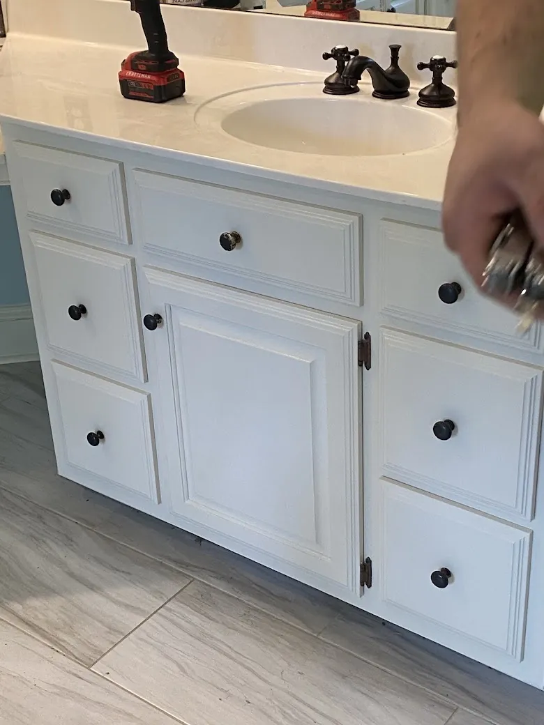 Freshly painted white bathroom vanity cabinet in the Ecru and Pontotoc area