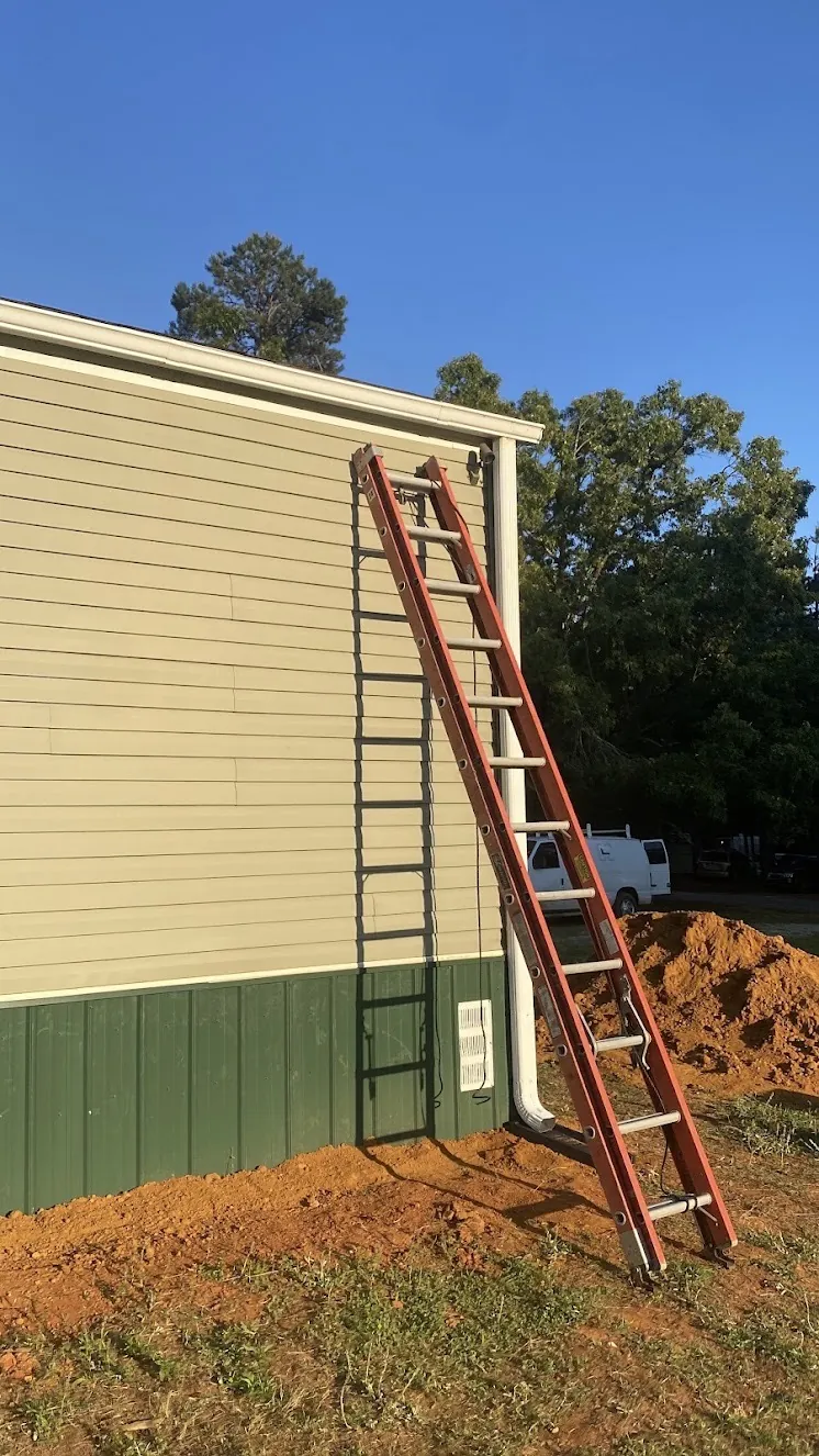 New gutter and downspout installed on a home in Ripley