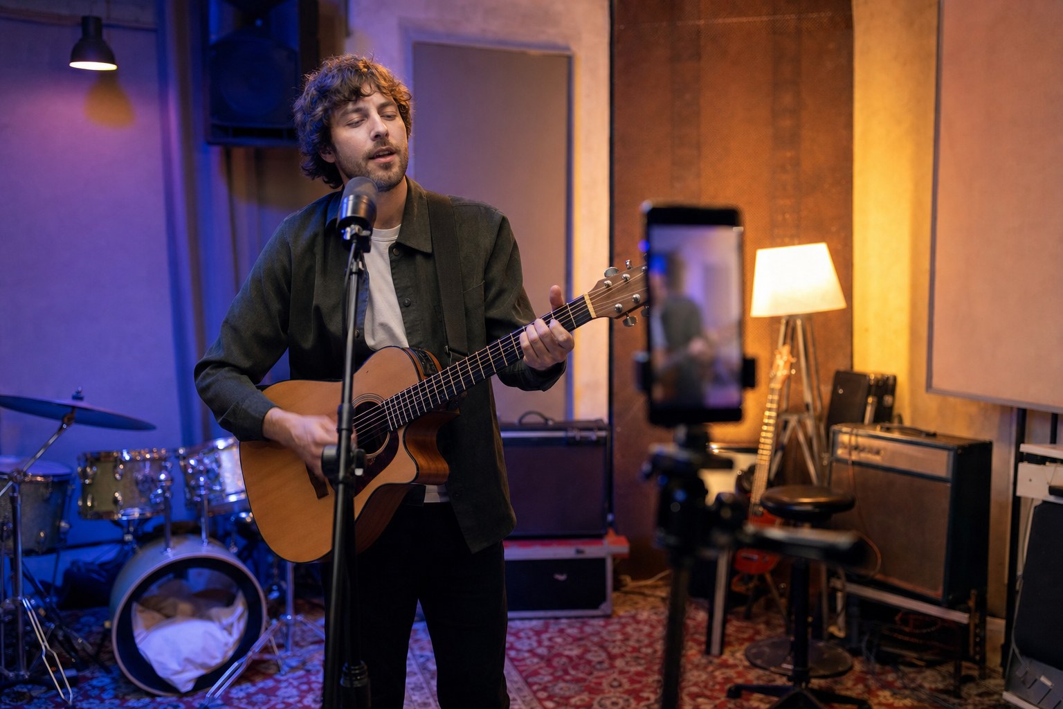 Independent musician recording a performance clip in a rehearsal studio