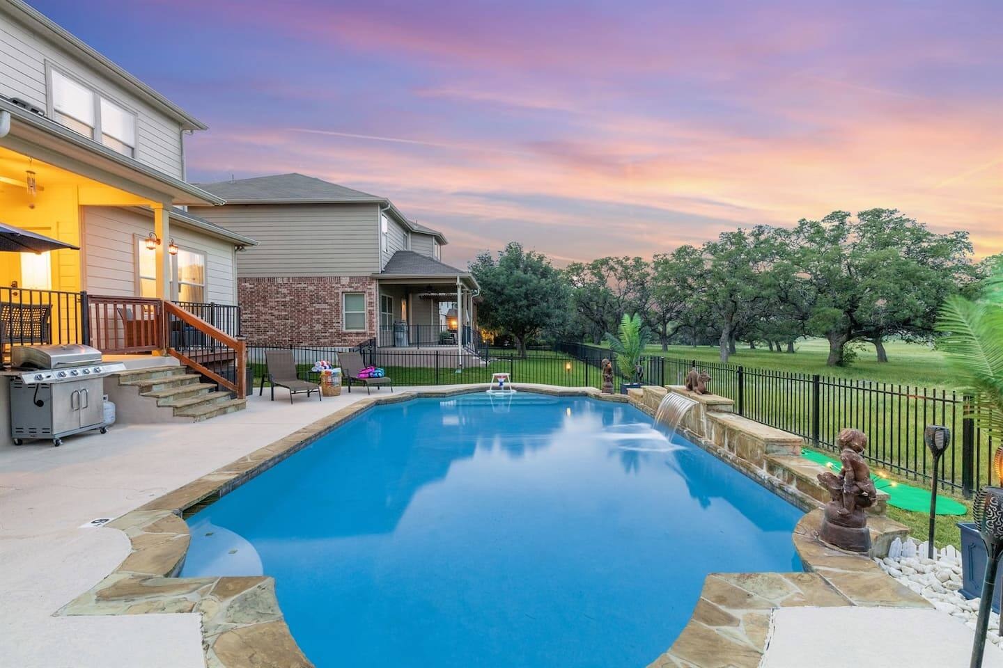 Private pool and backyard at sunset