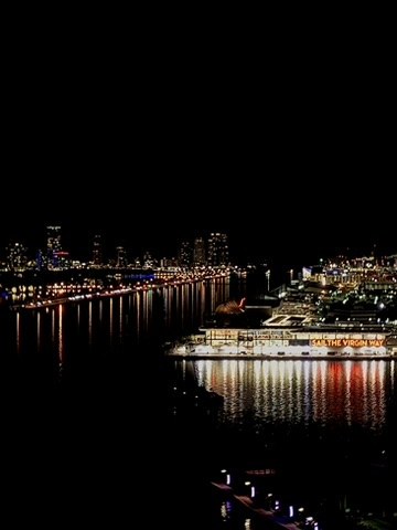 Waterfront lights reflected in dark water