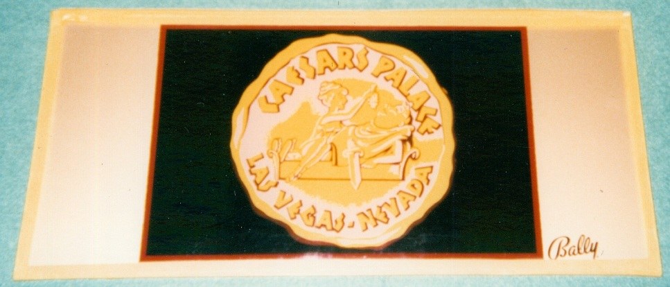 A vintage slot belly glass image featuring the logo of Caesars Palace, Las Vegas, Nevada, set against a dark background.