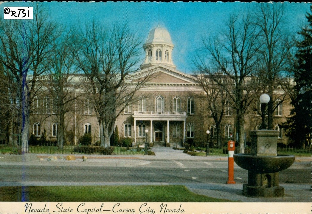 A vintage postcard of the Nevada State Capitol in Carson City, Nevada, showing the building's architecture surrounded by leafless trees and a fountain in the foreground.