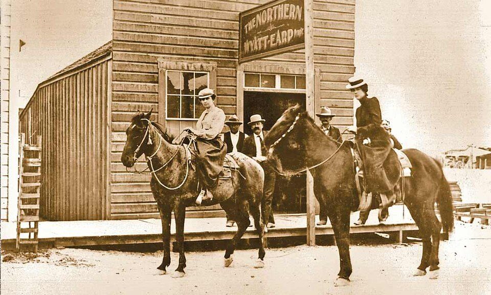 Horse riders outside the Northern saloon in Goldfield
