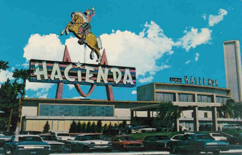 Historic Hacienda Hotel and Casino exterior with its horse-and-rider sign.