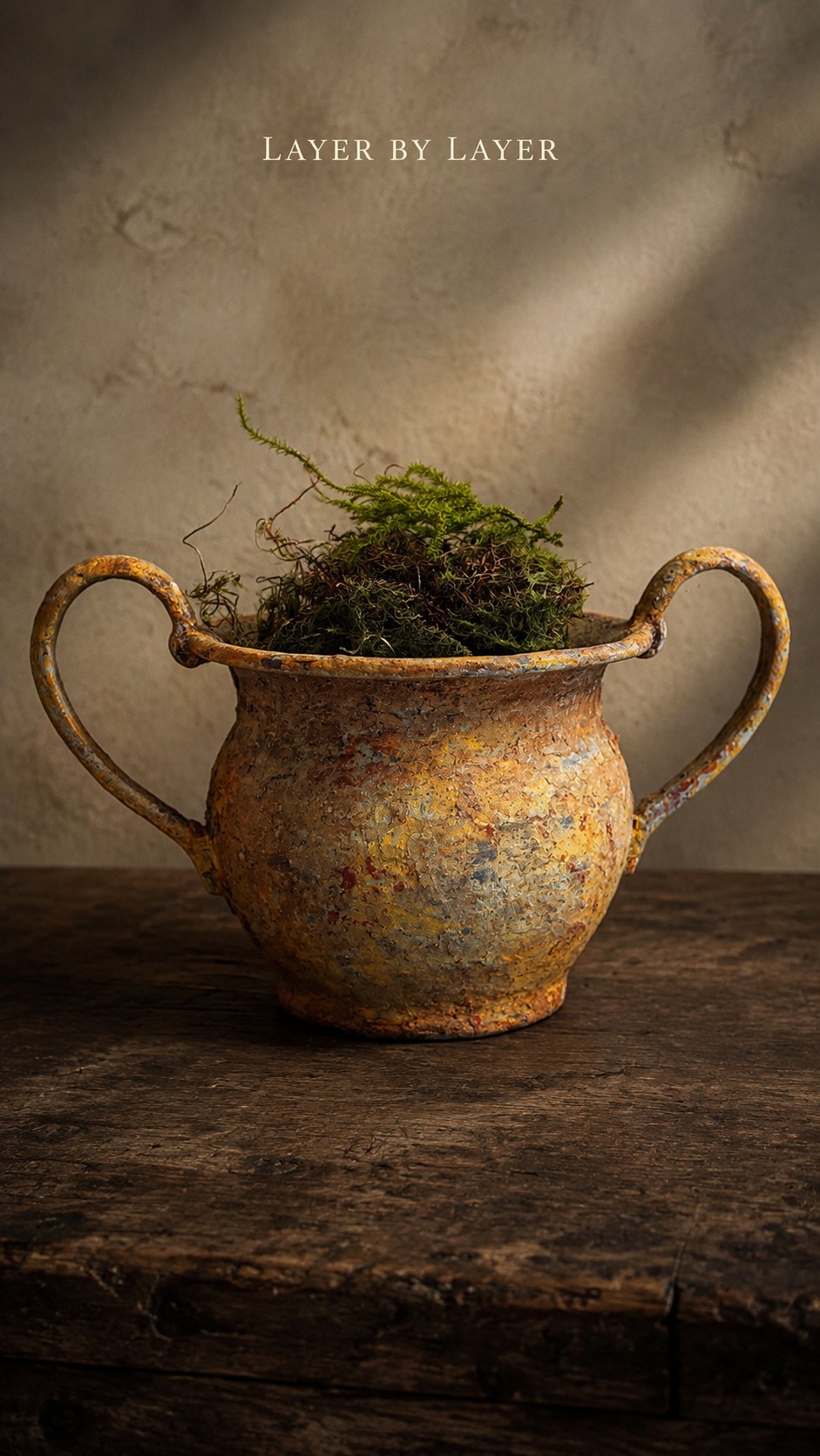Hand-finished vessel with layered patina and moss