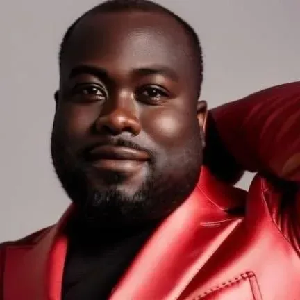 Author Jean Fatal wearing a red jacket