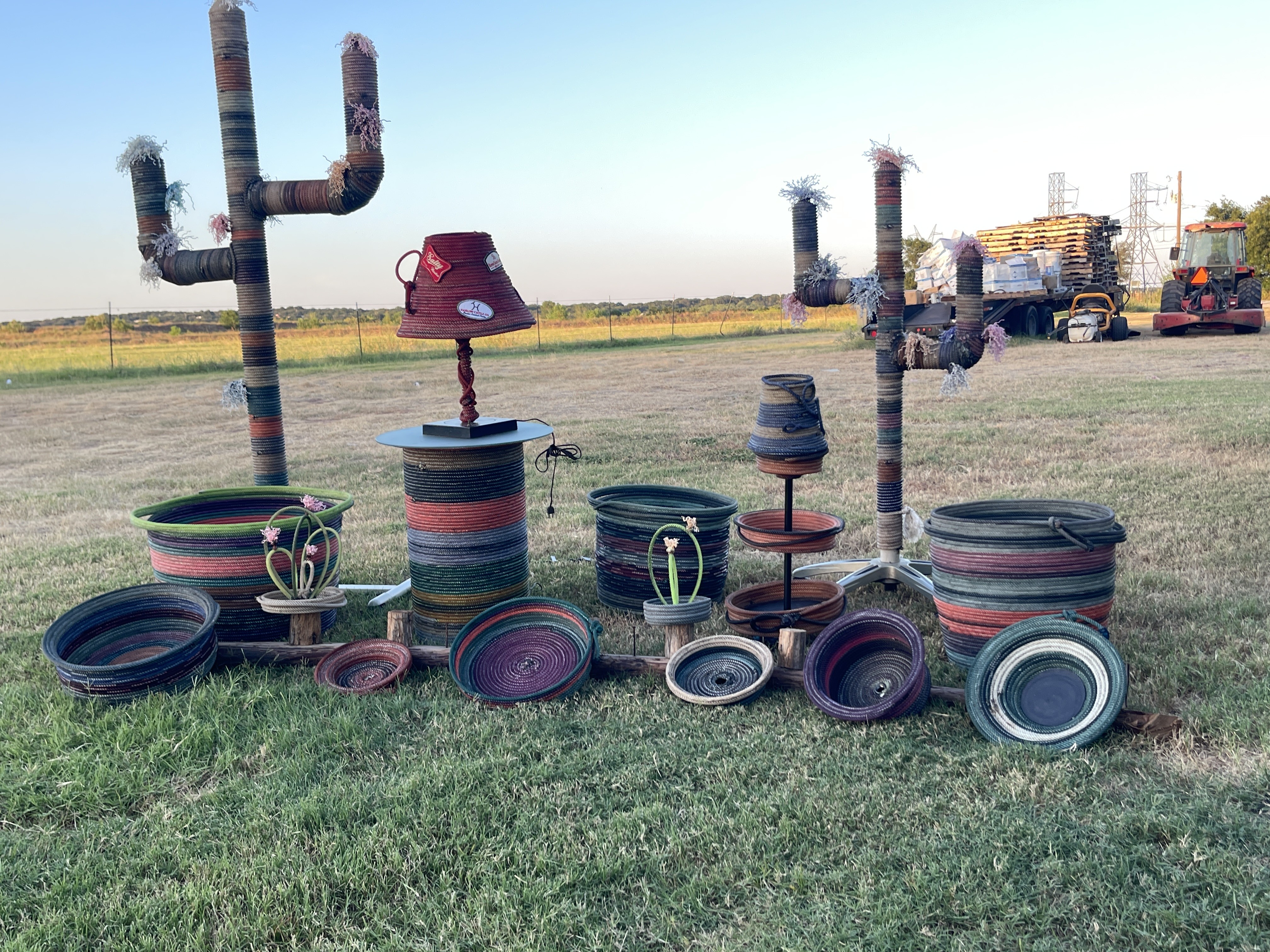 A display of Michelle’s handmade lariat rope baskets, lamps, and cactus forms