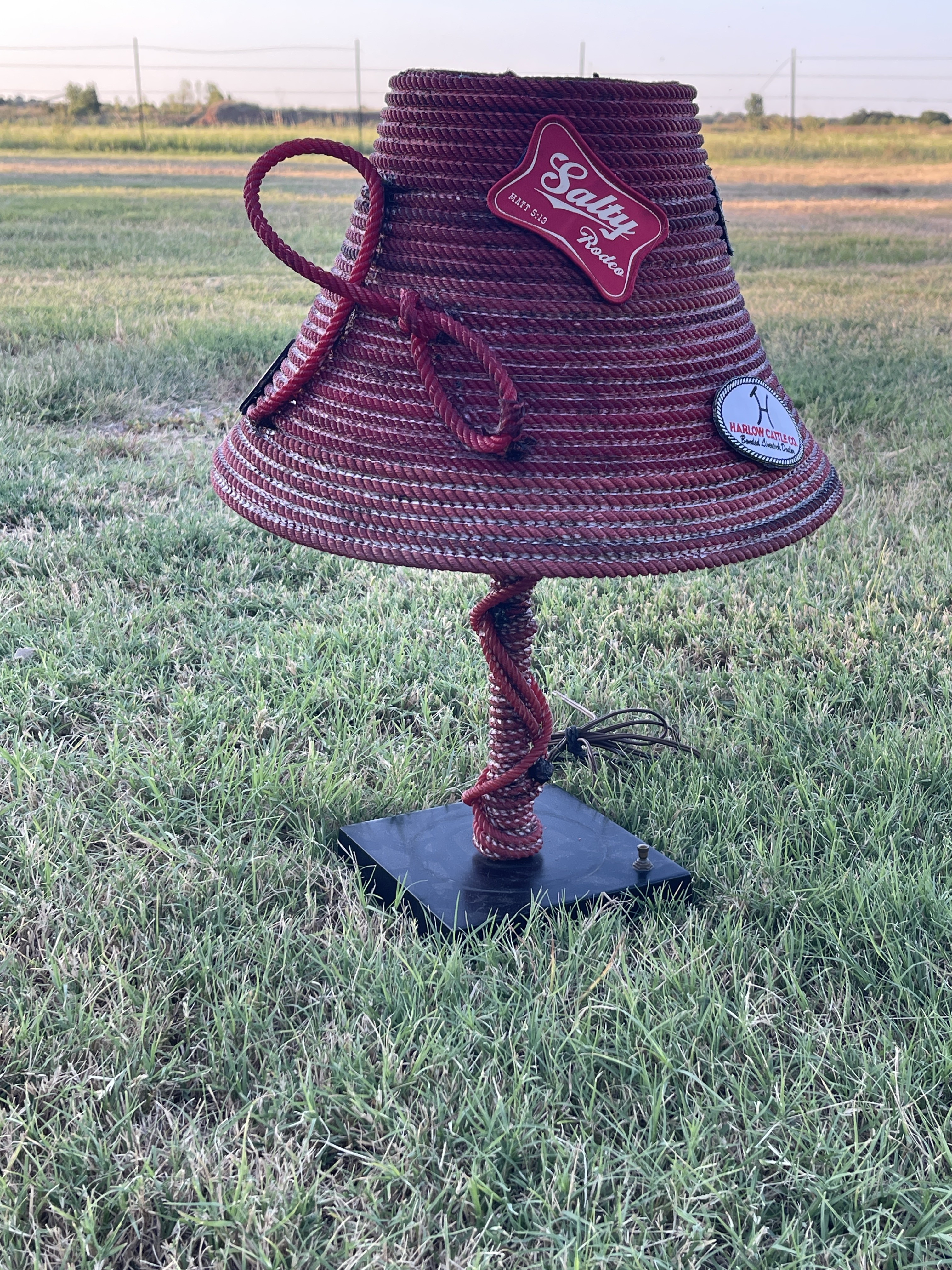 Handmade burgundy lariat rope lamp with a twisted rope base
