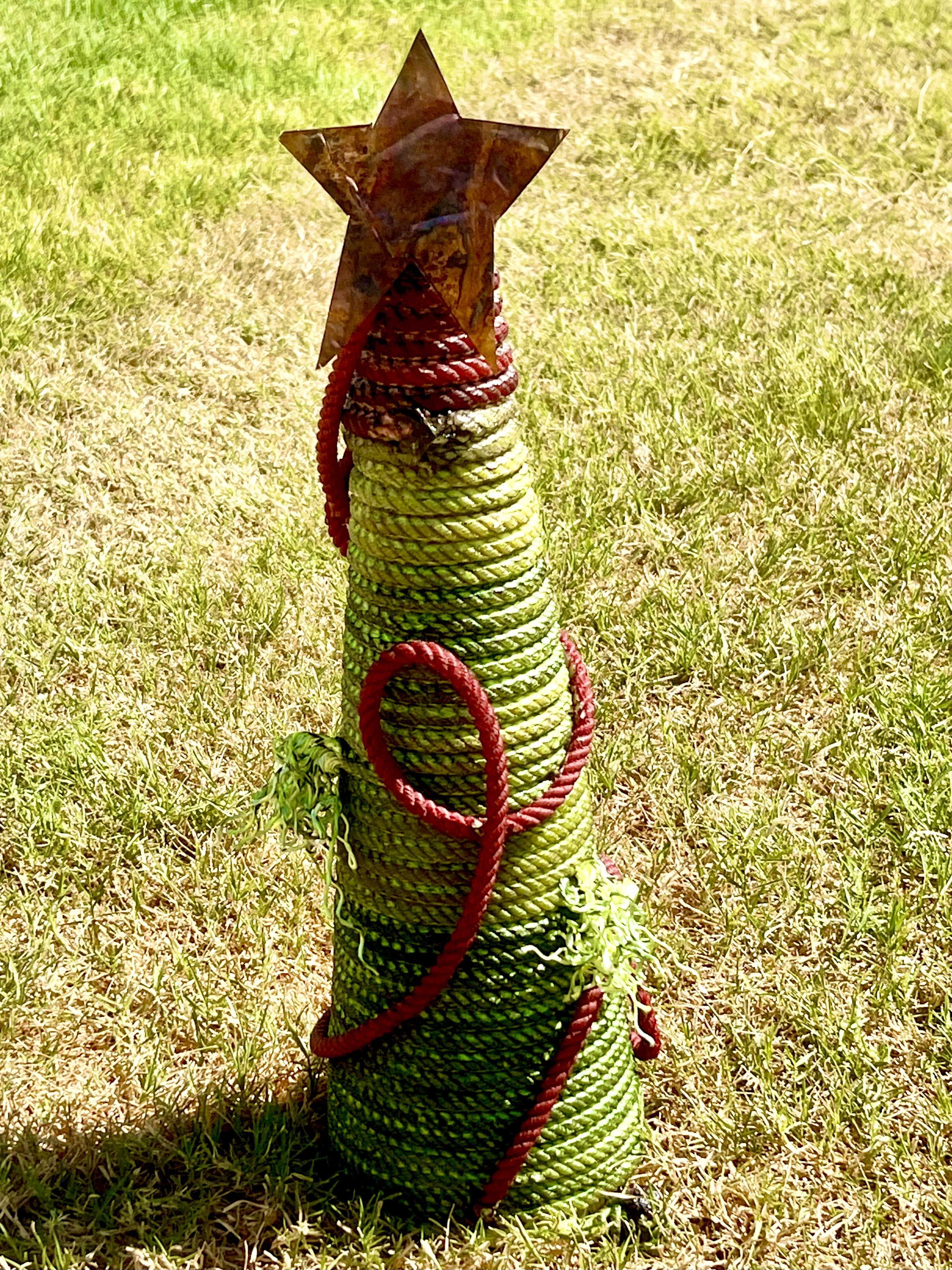 Handmade green rope piece with a rusted metal star