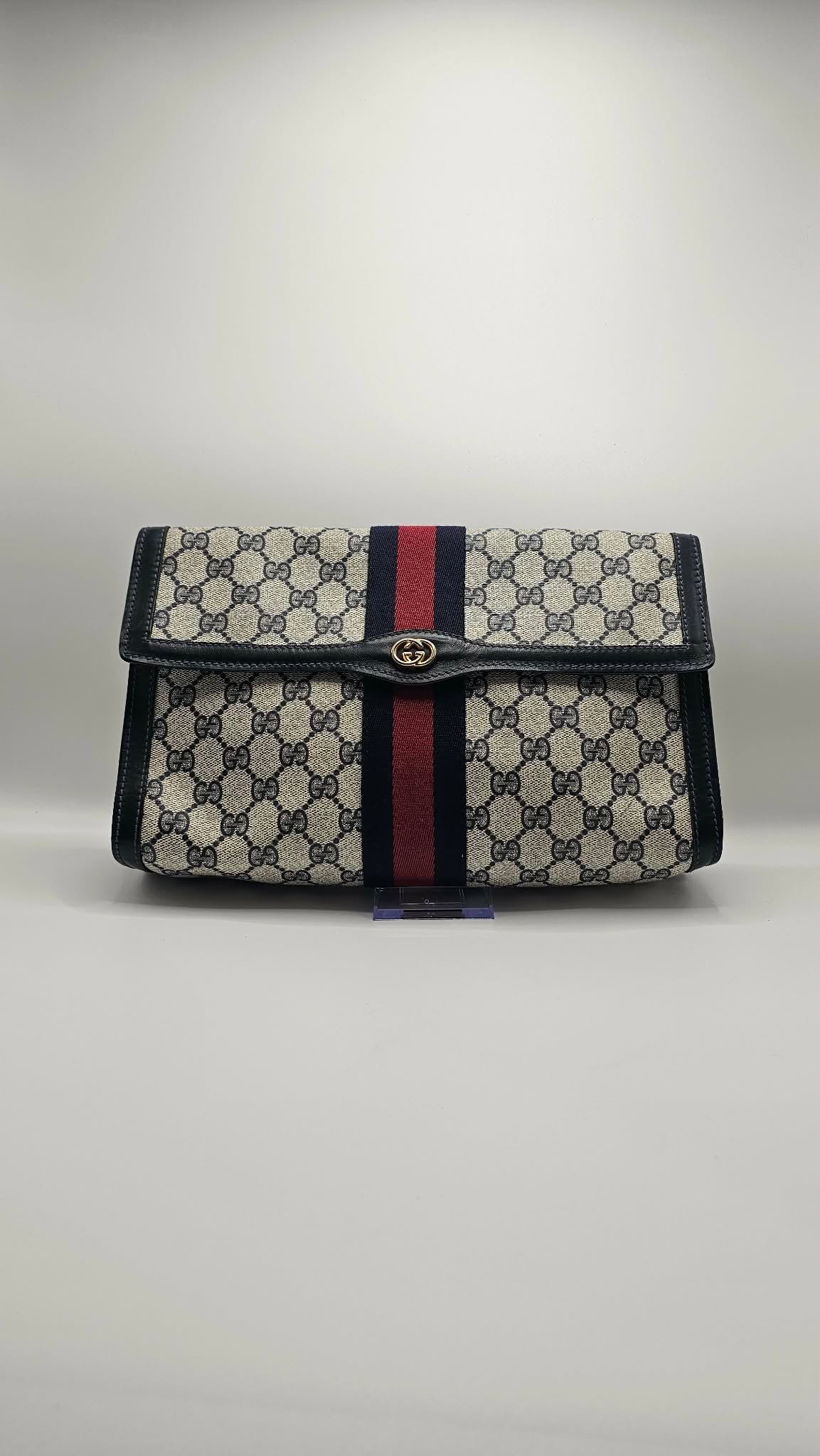 Gucci GG Supreme Vintage Clutch shown in the Afford-d'Luxe collection