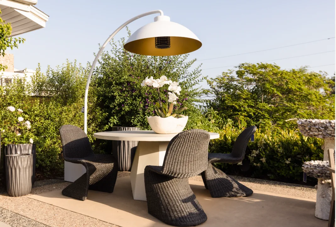 Home Crush outdoor dining with sculptural overhead heat and light