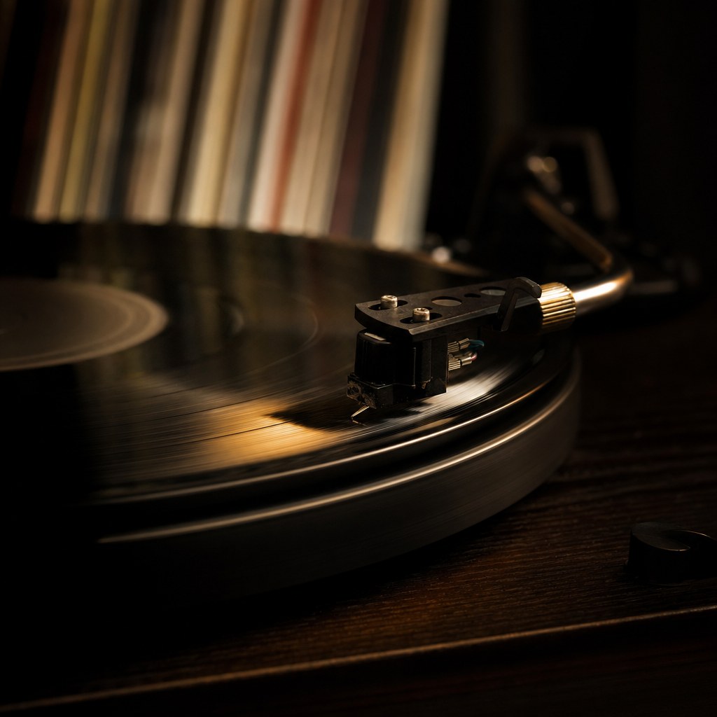 Turntable needle playing a vinyl record