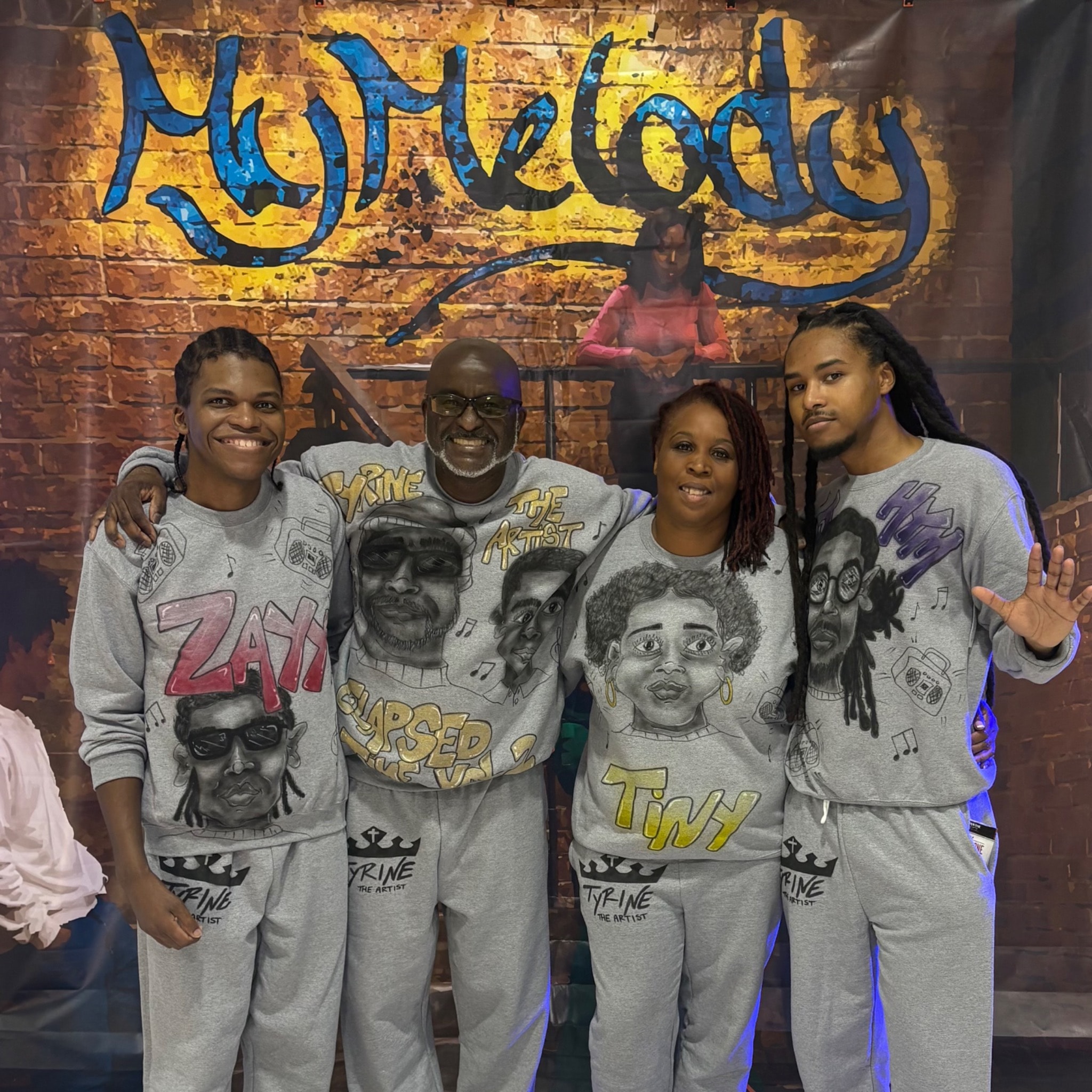 Tyrine the Artist with fellow performers at a live event