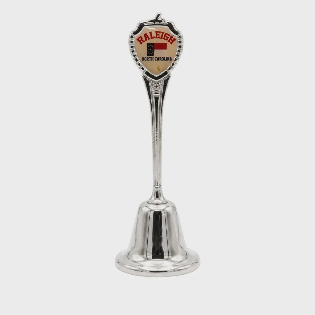 Raleigh North Carolina Souvenir Metal Zinc Long Bell
