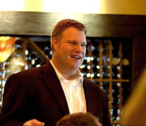 Chris Williams connecting with people at a business event