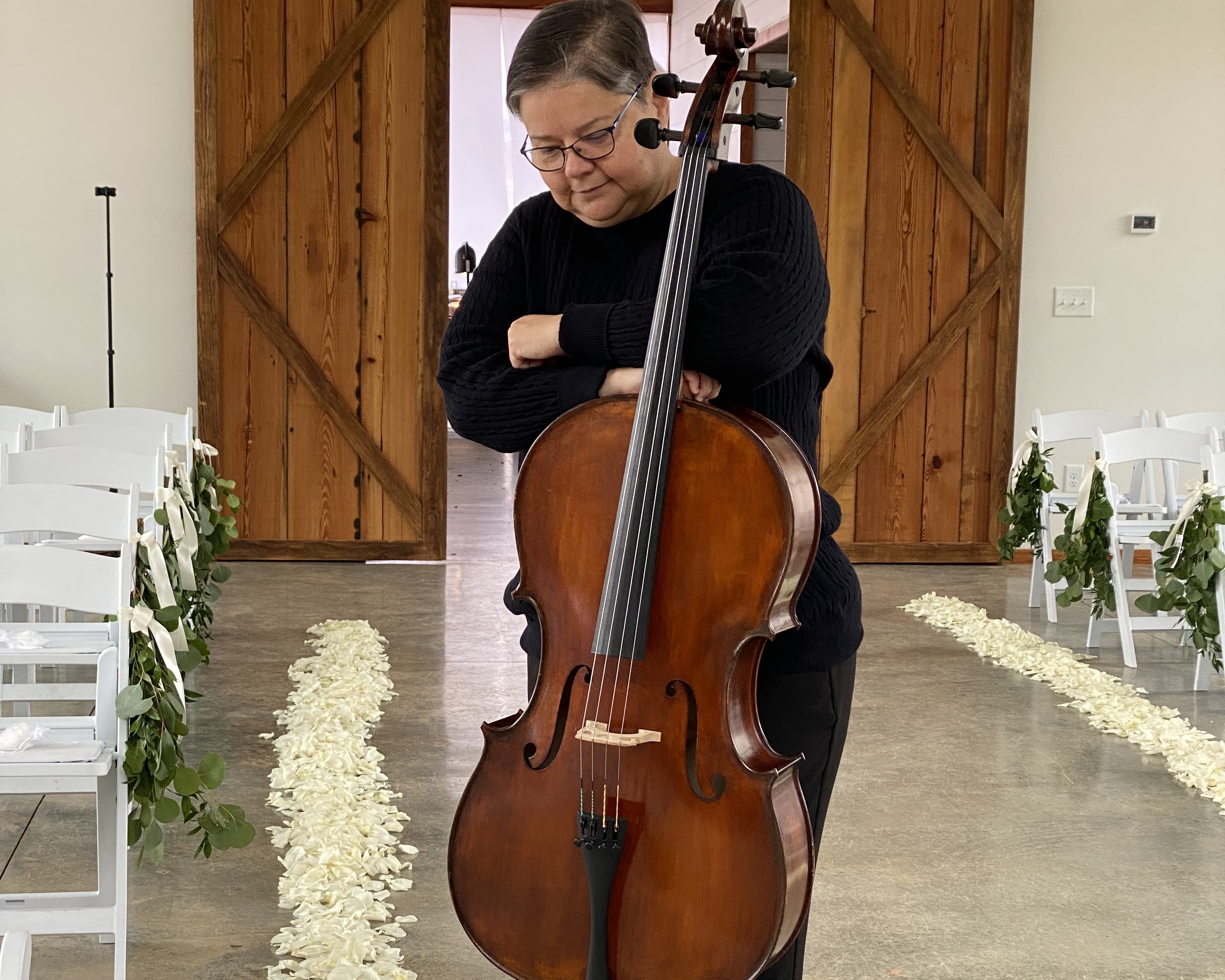 A cellist performing on cello.