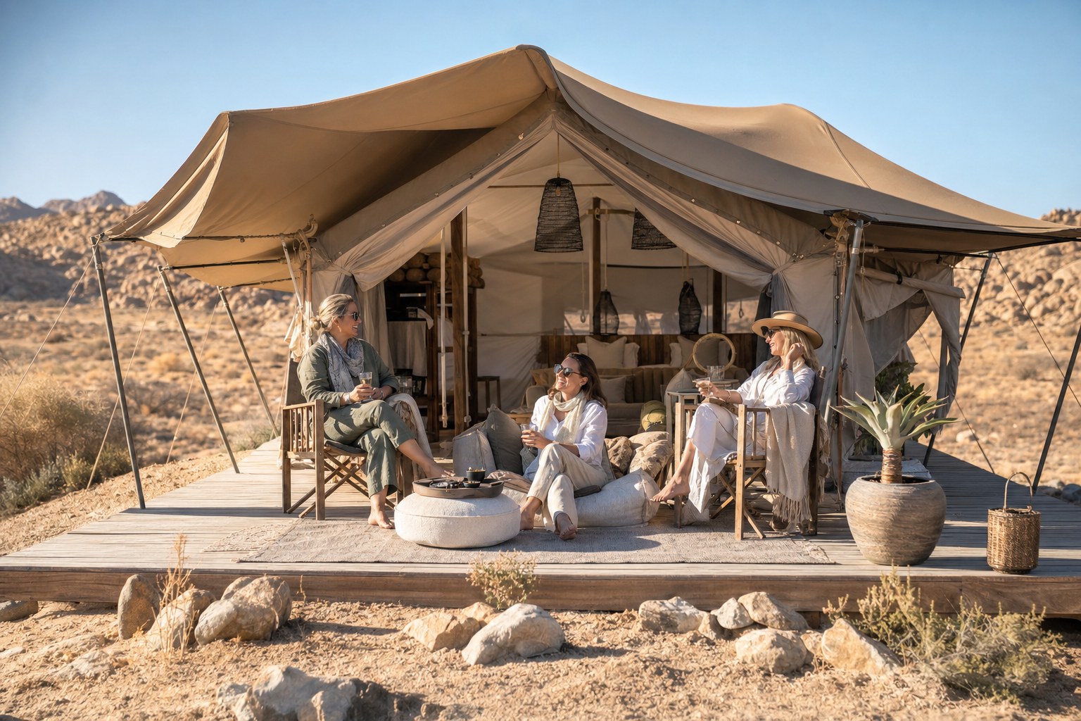 Women relaxing outside a safari tent
