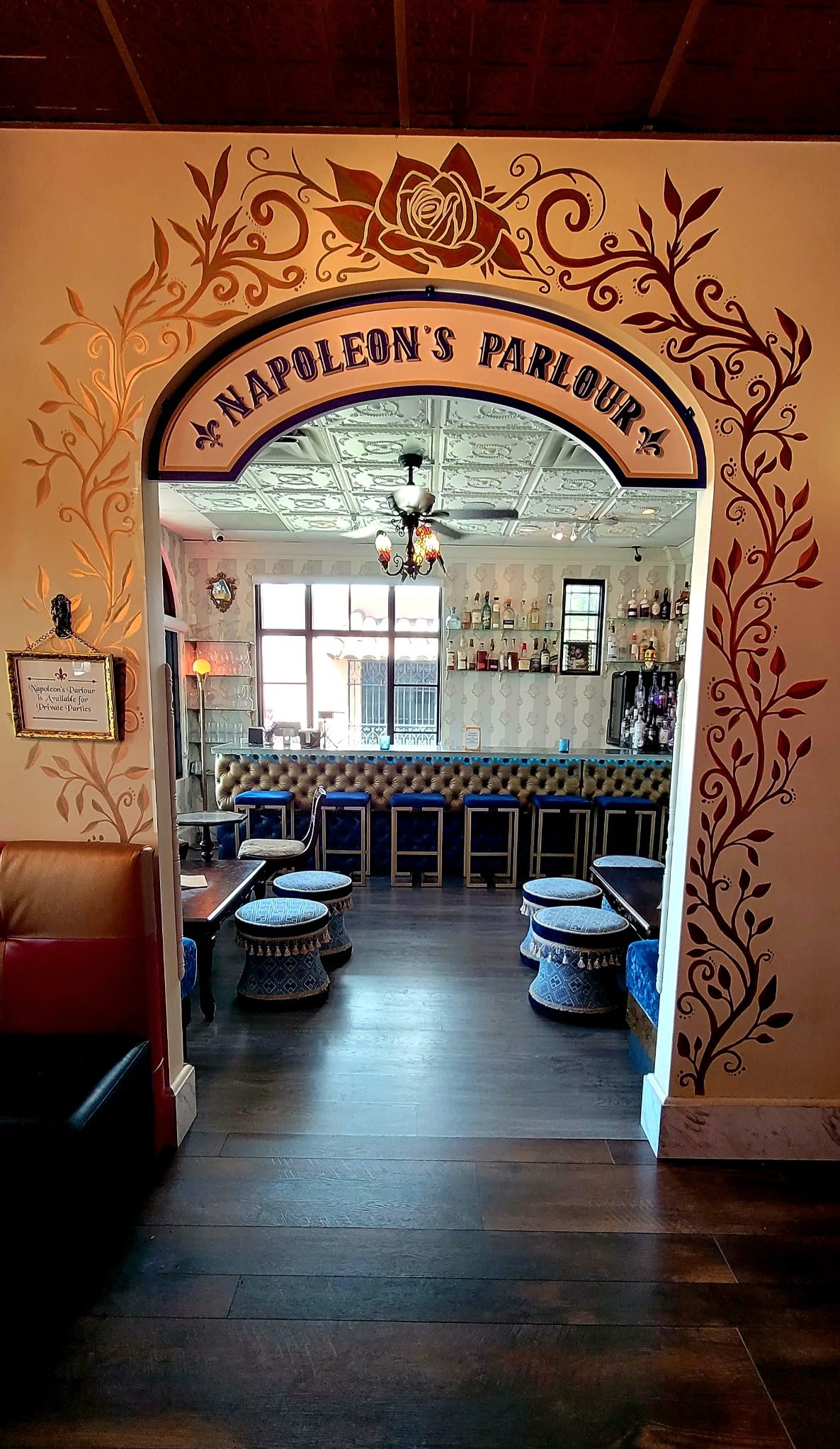 The decorative Napoleon’s Parlour archway and seating at Vinos on Las Olas