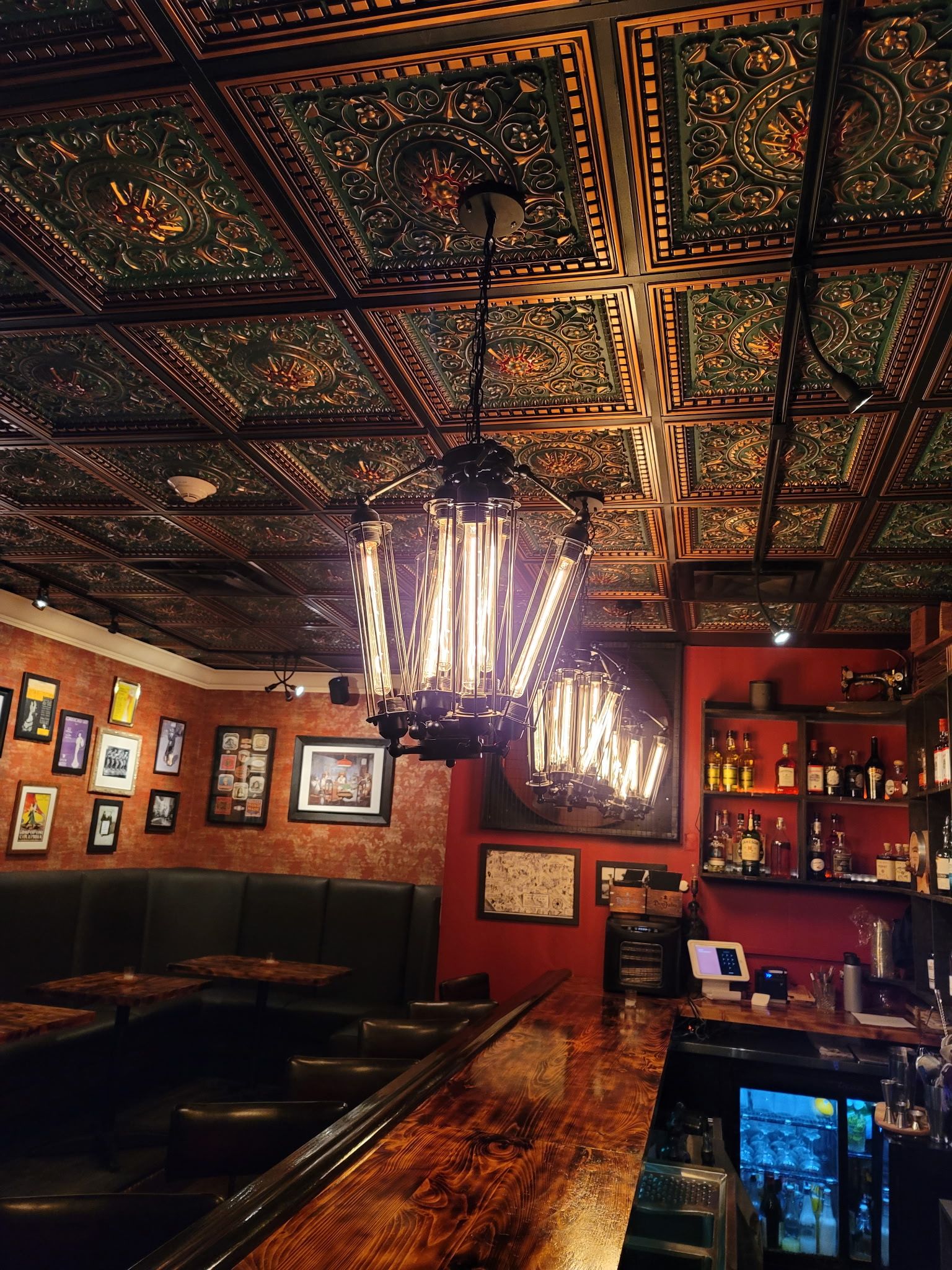 Sidecar’s wooden bar, hanging lights and ornate ceiling