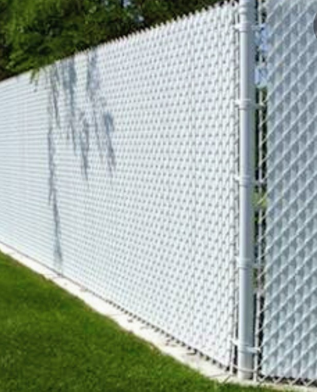 Chain-link fence with a white privacy screen