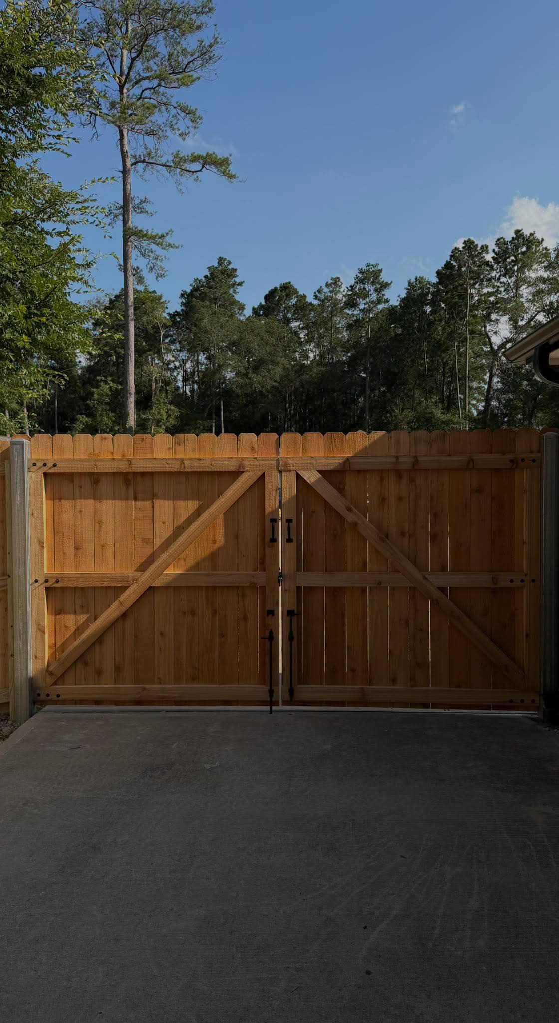 Finished wood double driveway gate installed by Vickers Fence