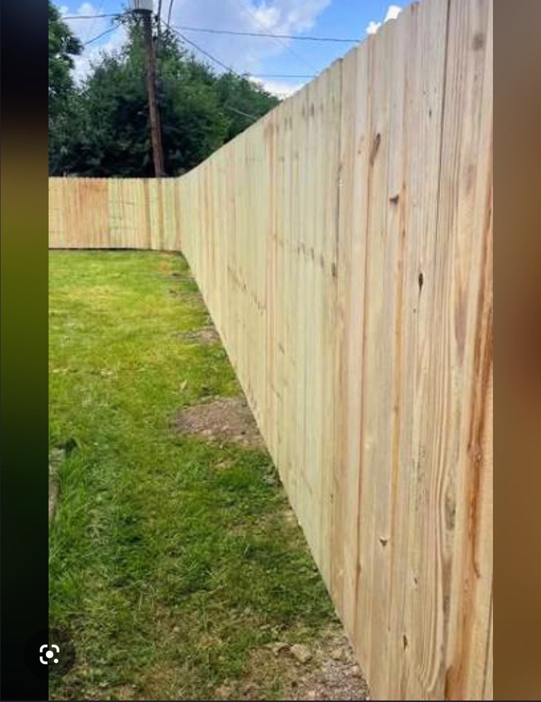 Wood privacy fence along a residential Stonewall-area side yard