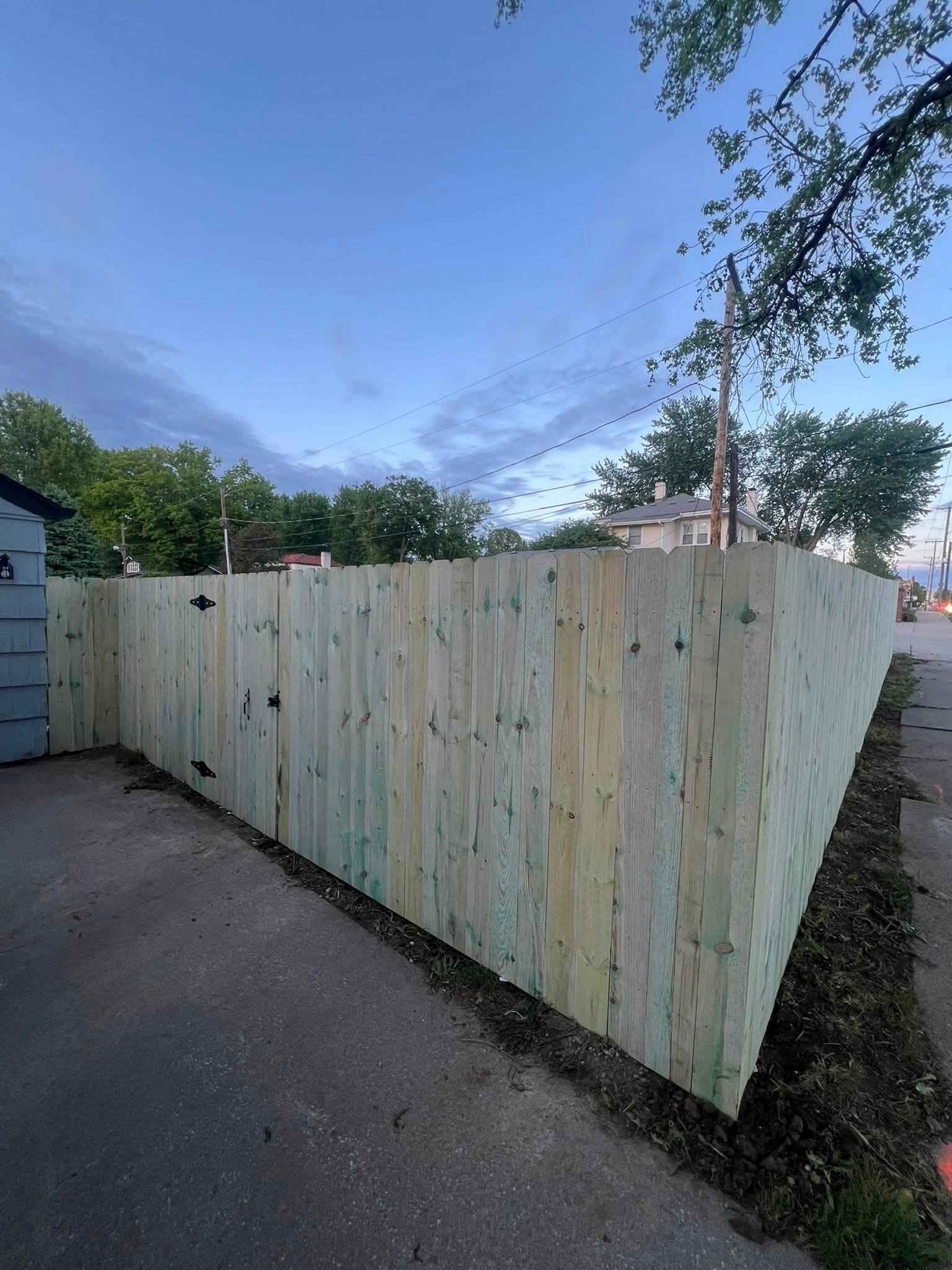 Wood privacy fence at a backyard corner