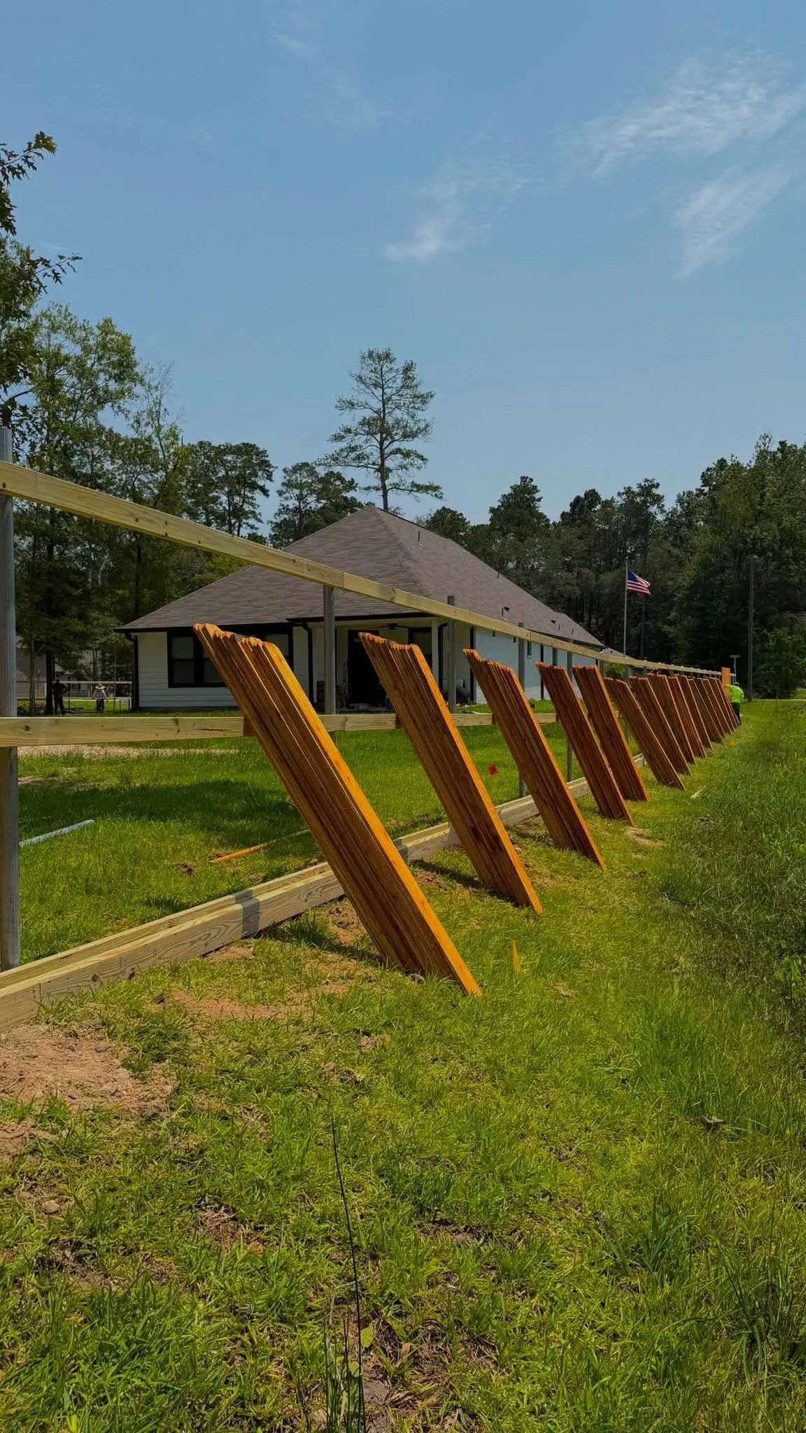 Temporary bracing supporting a wood fence installation