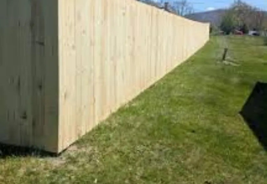 Long run of new wood privacy fencing