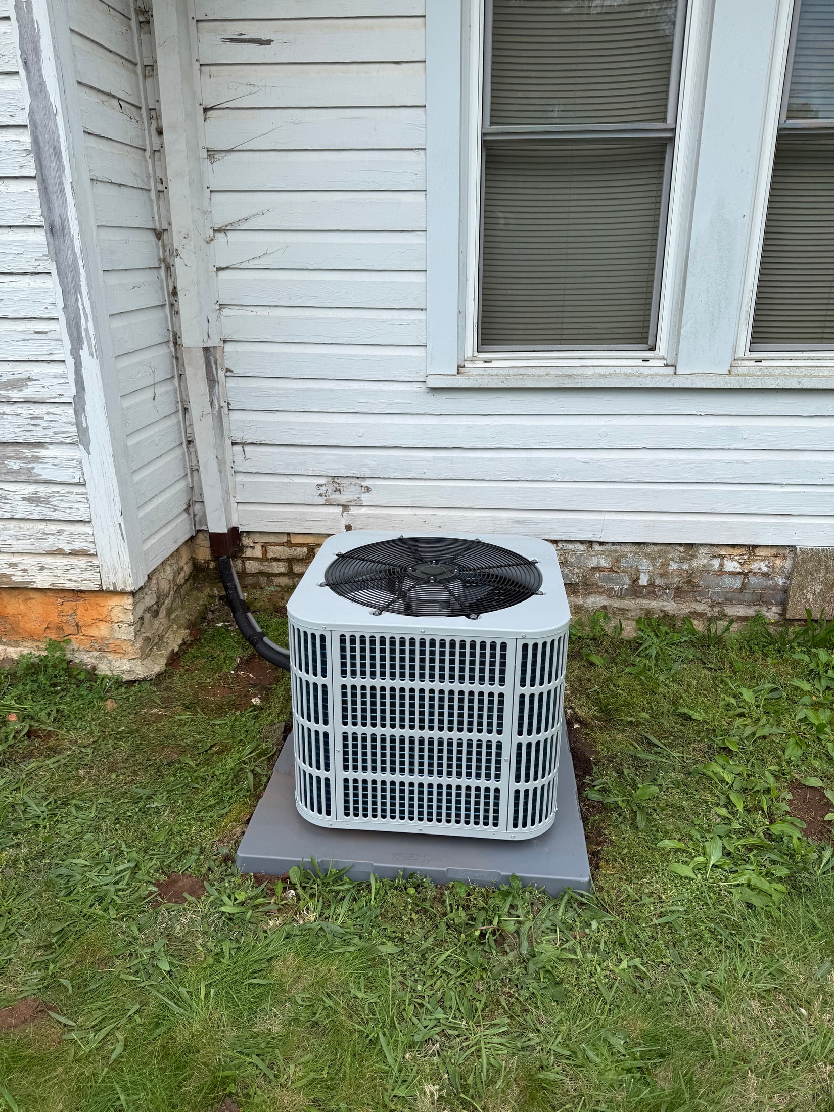 Newly installed residential outdoor air conditioning unit
