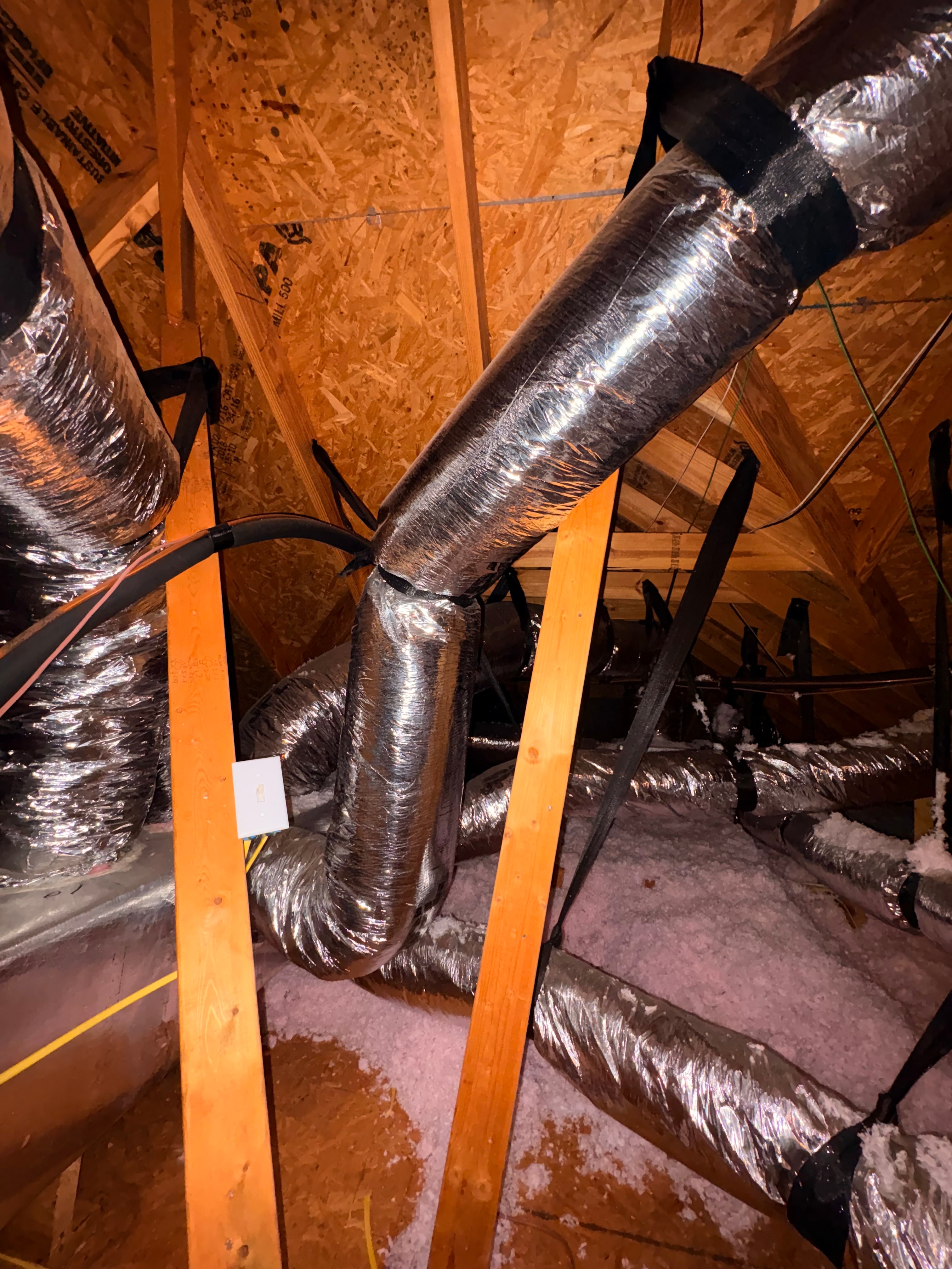 Flexible ductwork installed in a residential attic