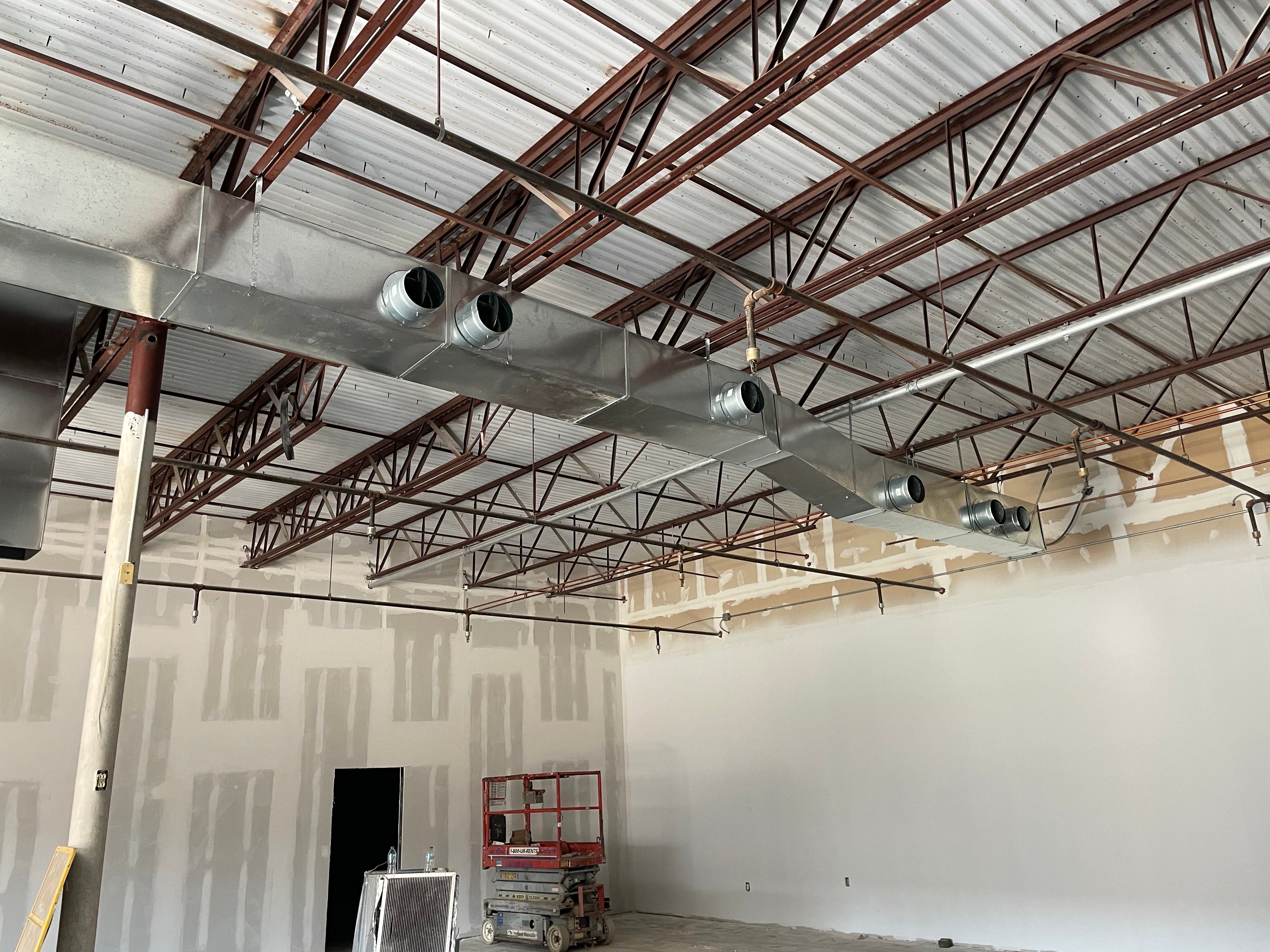 New commercial ductwork installation in an open building interior