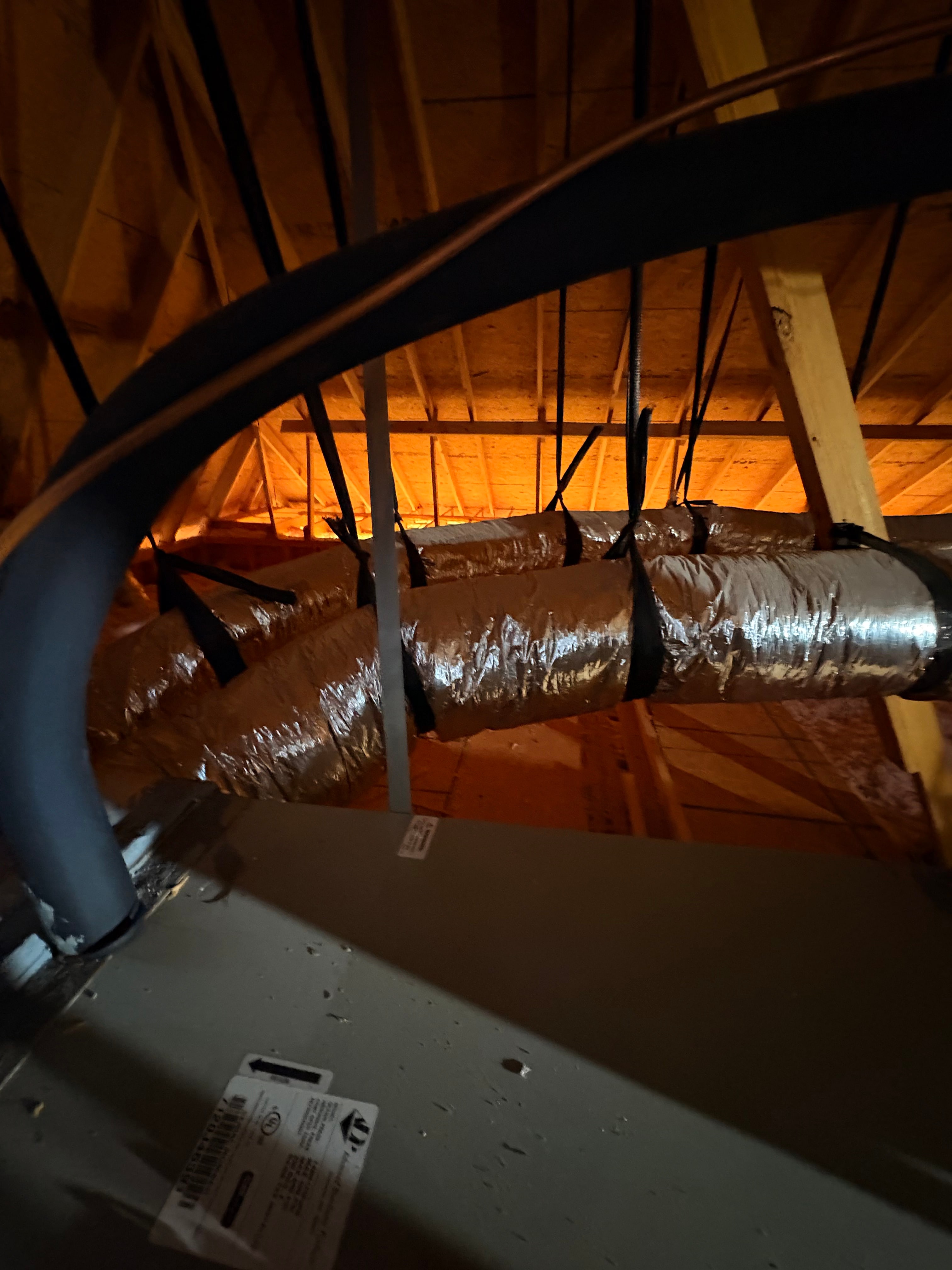 Flexible ductwork routed through a residential attic