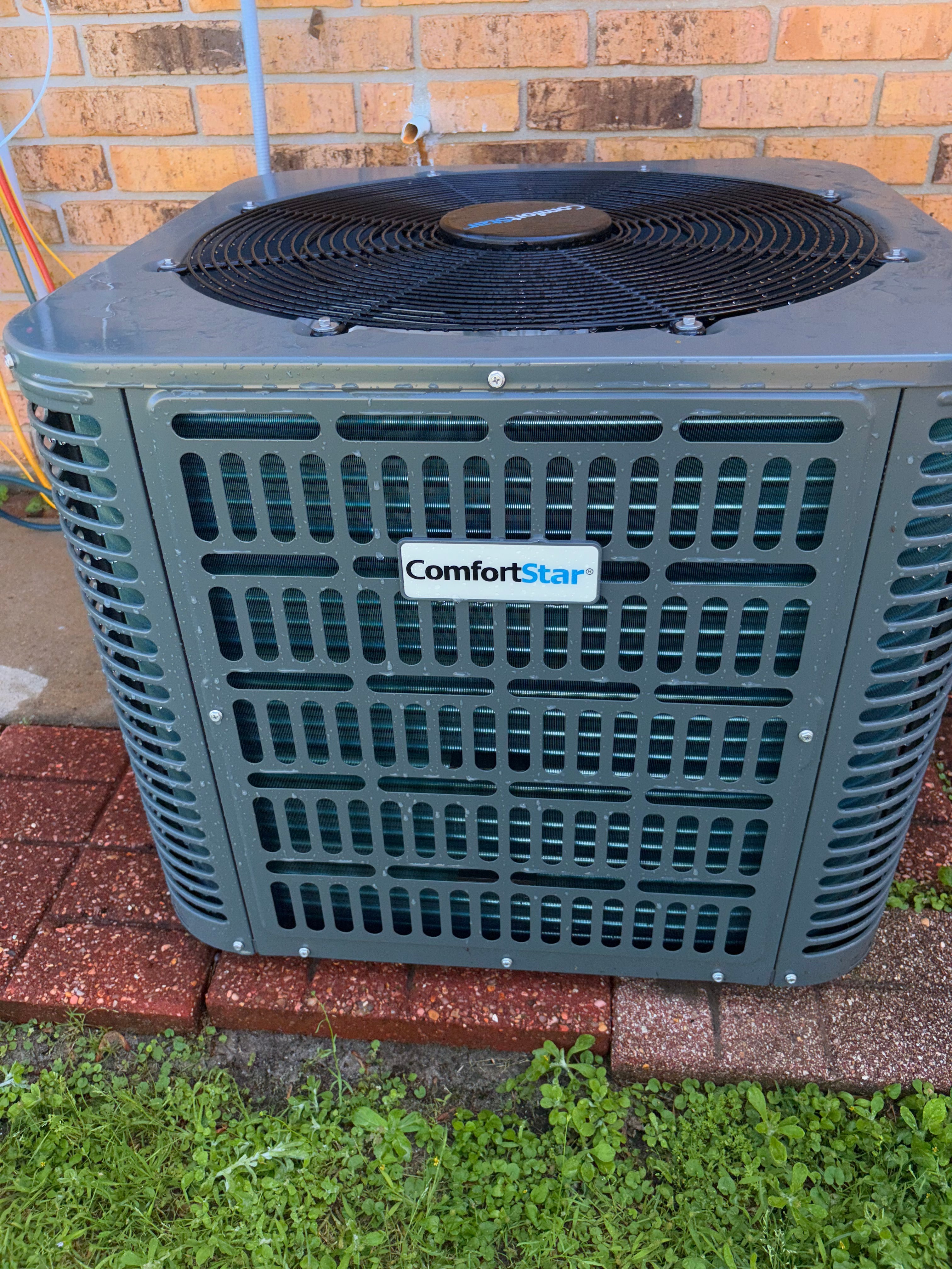 Outdoor air conditioning condenser installed at a home
