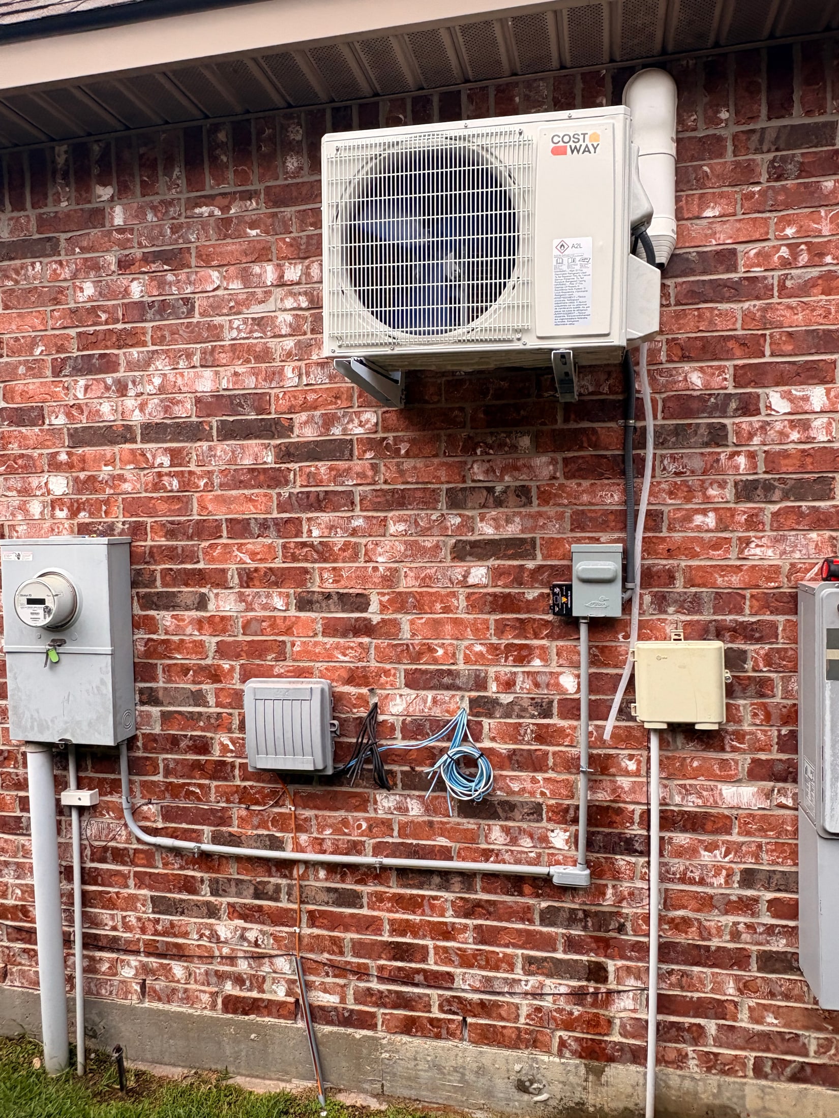 Ductless mini-split system installed on a brick home