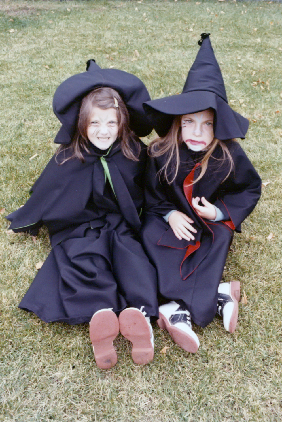 Two children dressed as witches for Halloween
