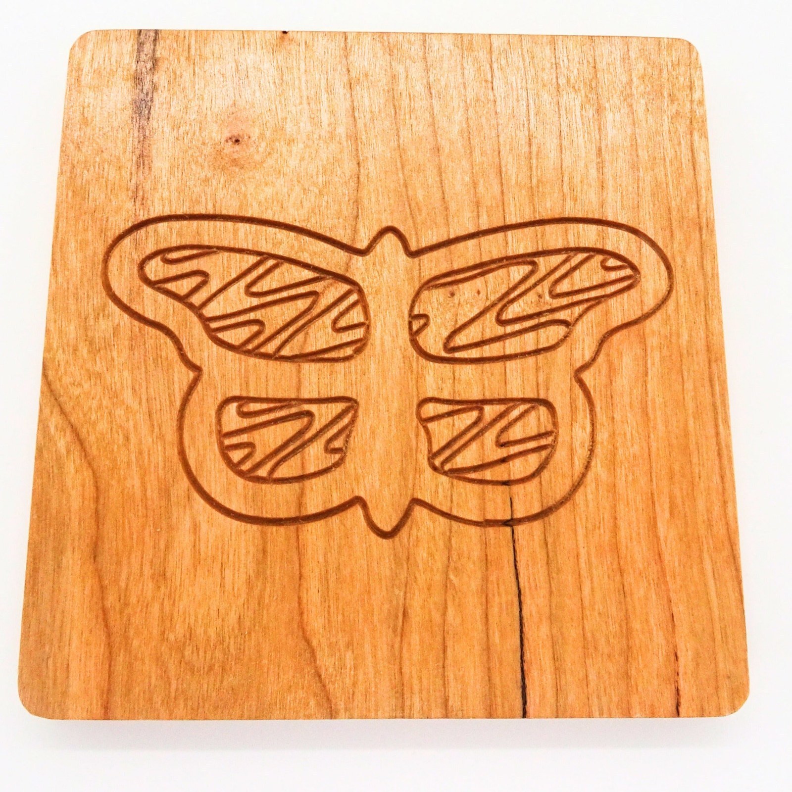 Engraved hardwood drink coaster with an owl design