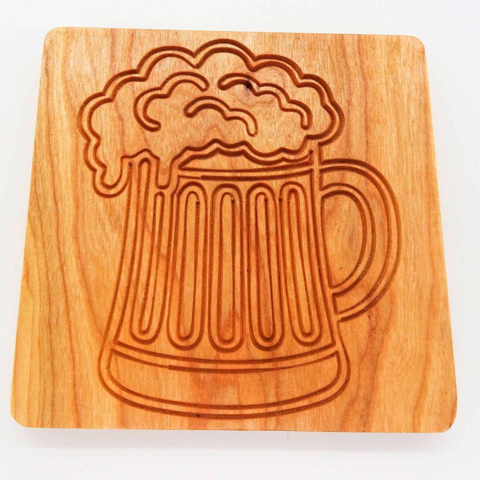 Engraved hardwood drink coaster with a rainbow design