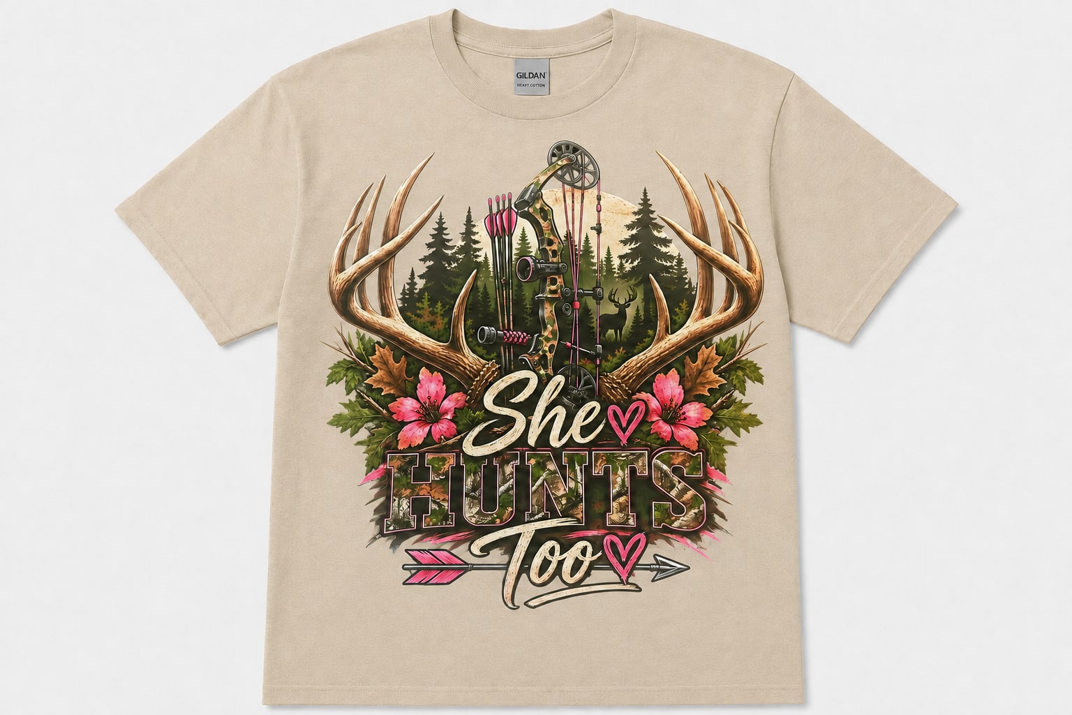 Sand-colored She Hunts Too graphic T-shirt with a camo bow, antlers, pink flowers, and arrows