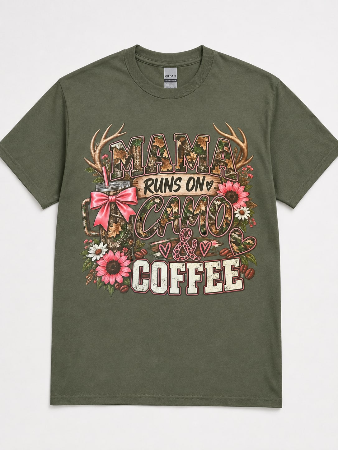 Olive green Mama Runs On Camo and Coffee graphic T-shirt with camo lettering, pink bow, flowers, and antlers