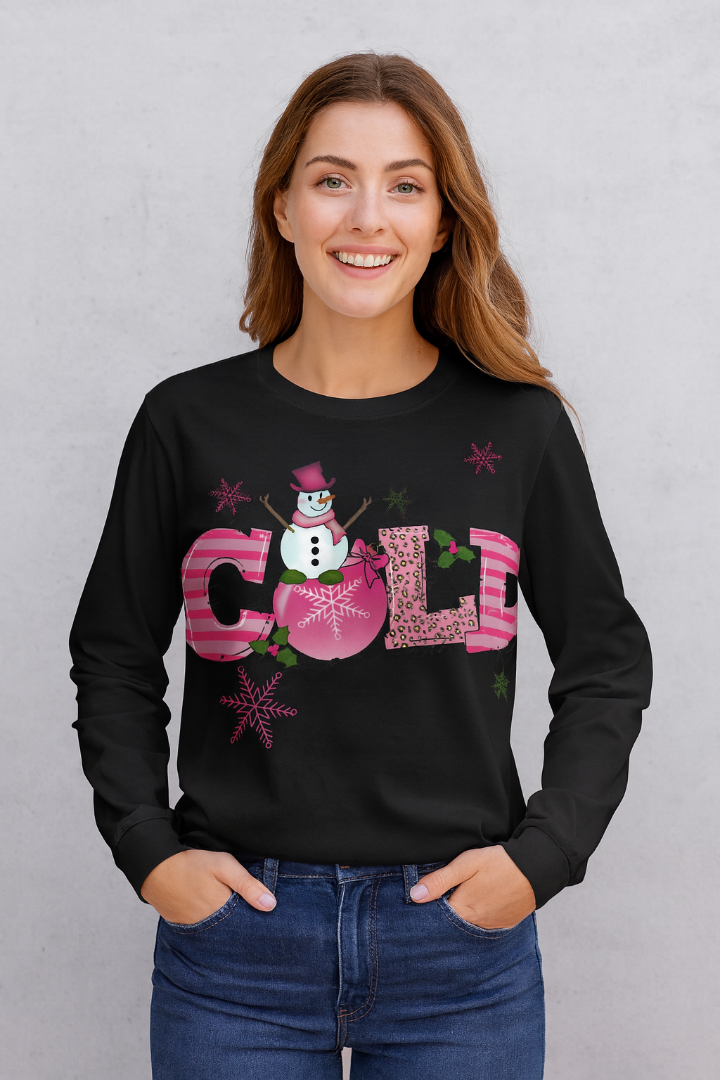 Woman wearing black long sleeve with the word COLD with snowman graphic.