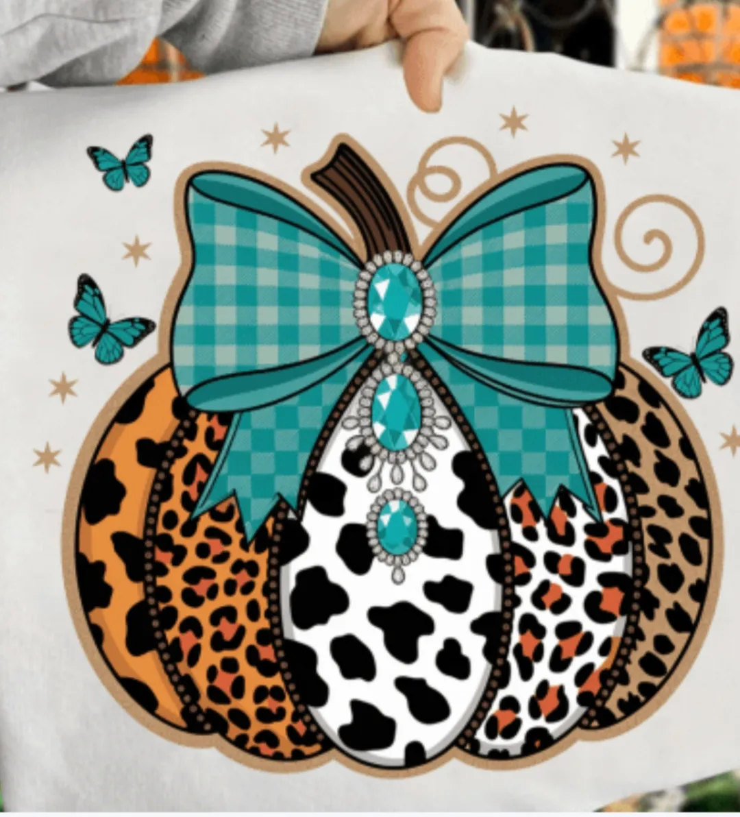 Pumpkin design with bow and butterflies. 2 Sisters Tanks Teez and More.