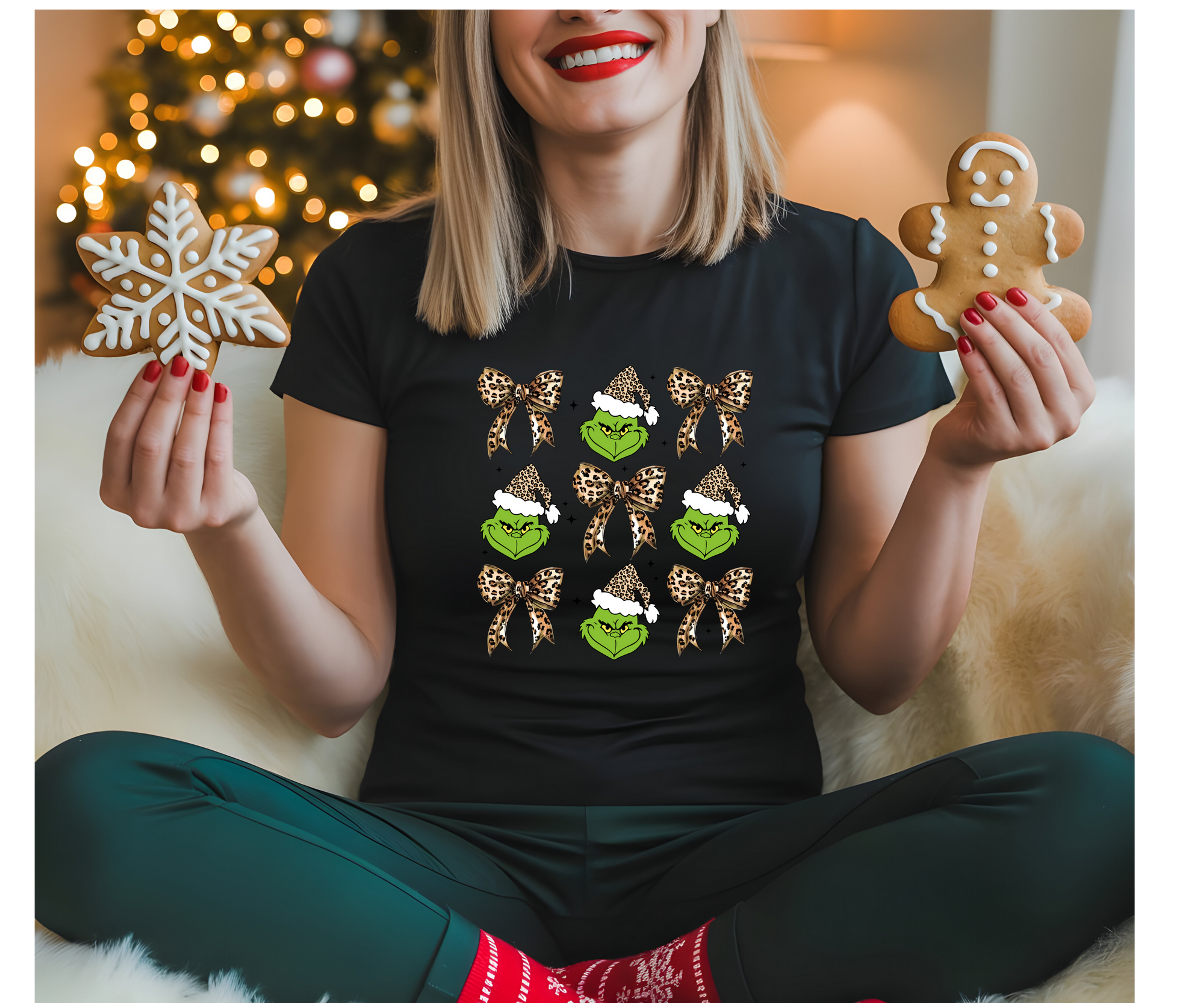 Woman wearing Grinch tee holds snowflake and gingerbread. Pickle Christmas.