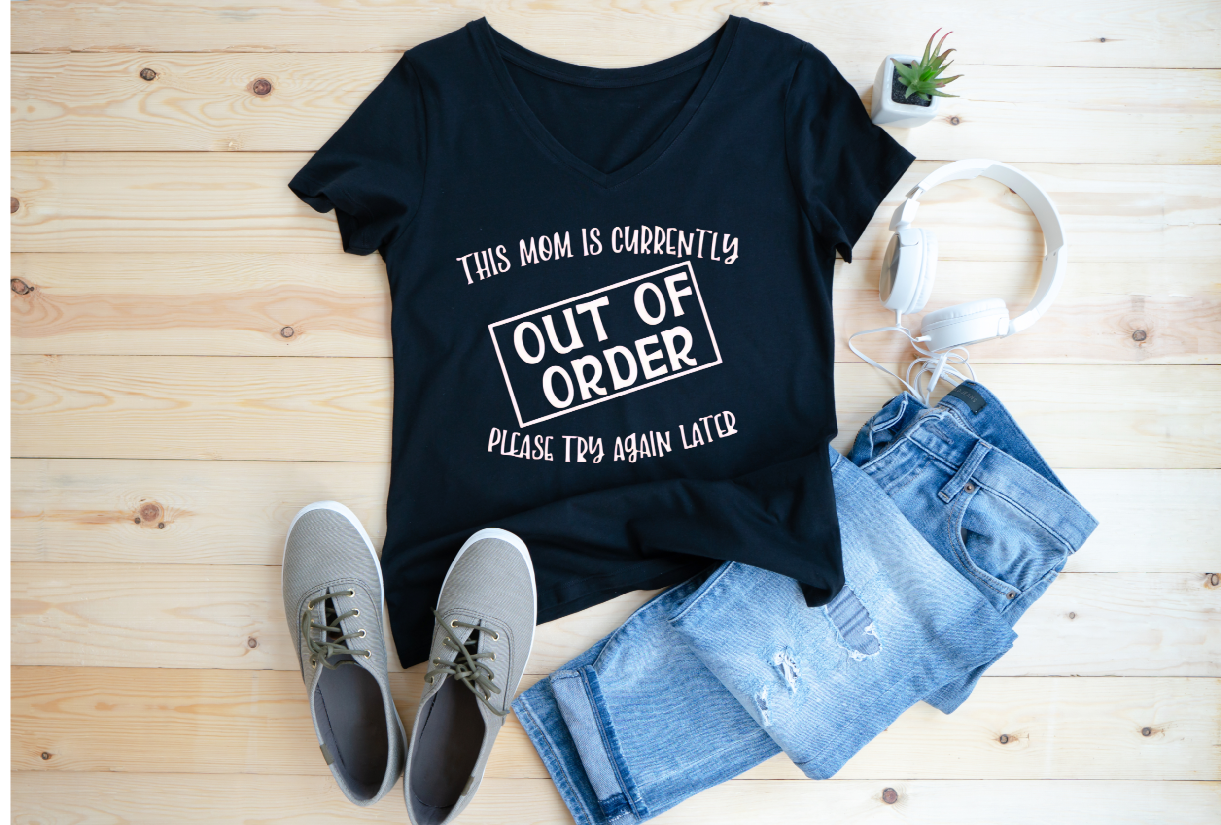 Rolled Gildan 5000 Adult Unisex T-Shirt in various colors displayed Navy and Black.