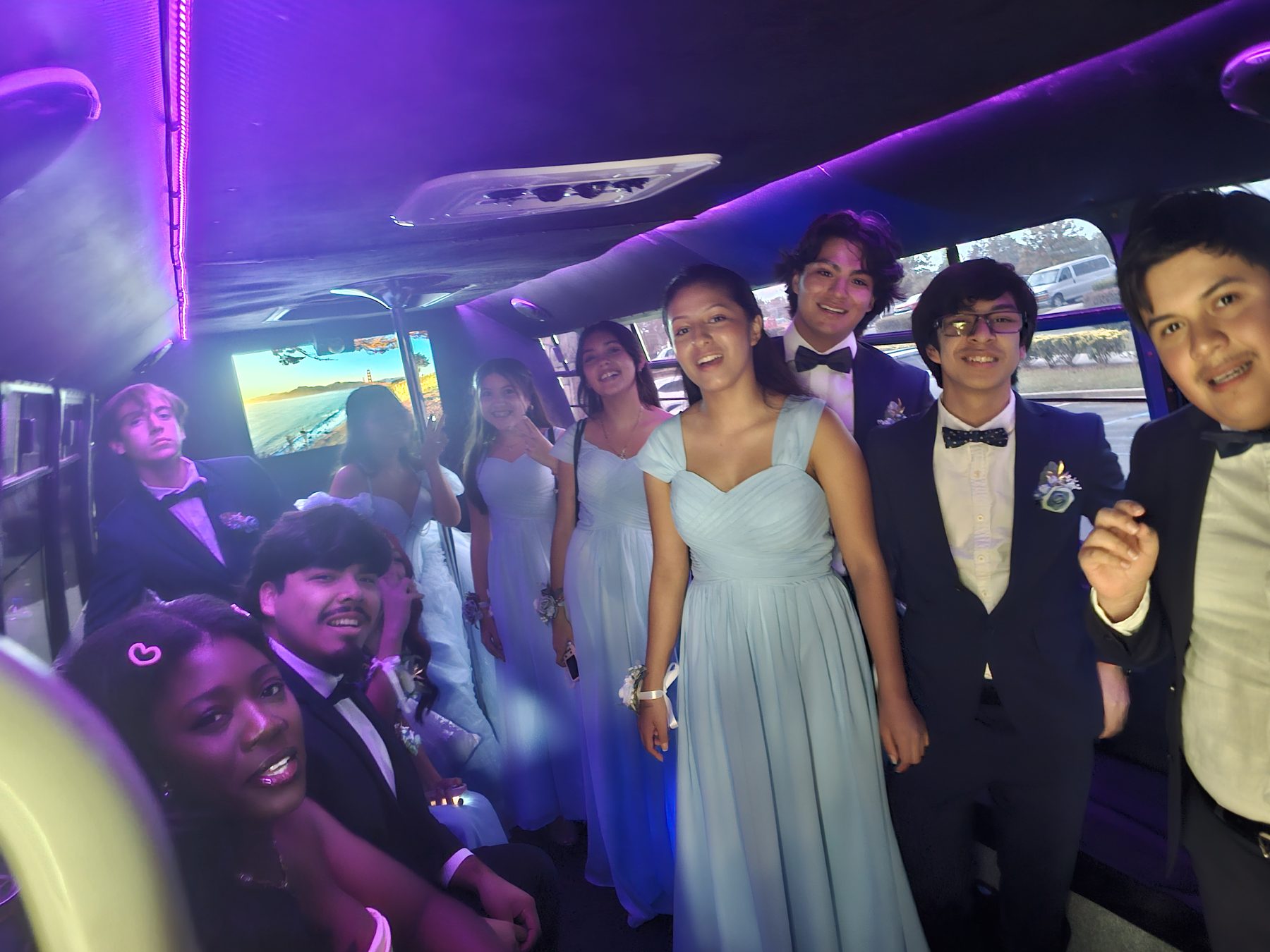 A quinceañera group celebrating inside Kiwe’s Party Bus