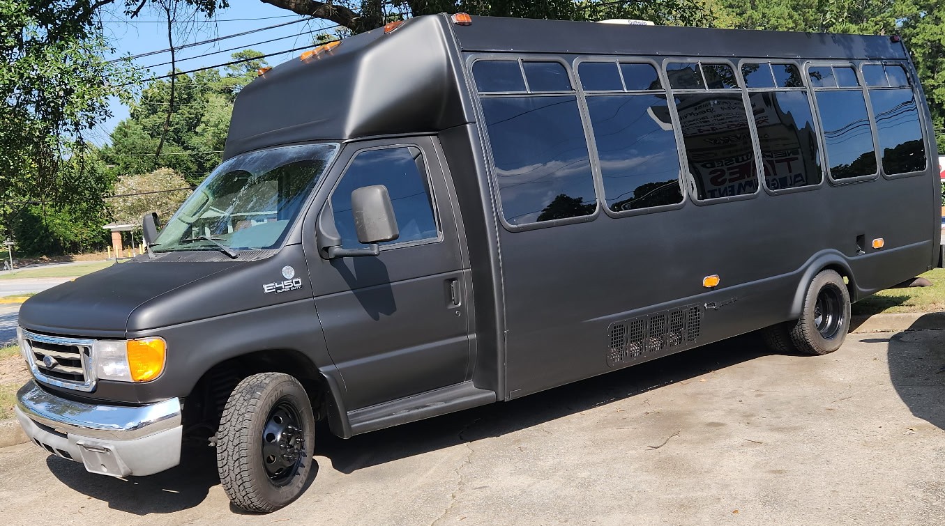 Kiwe’s black party bus exterior in Atlanta