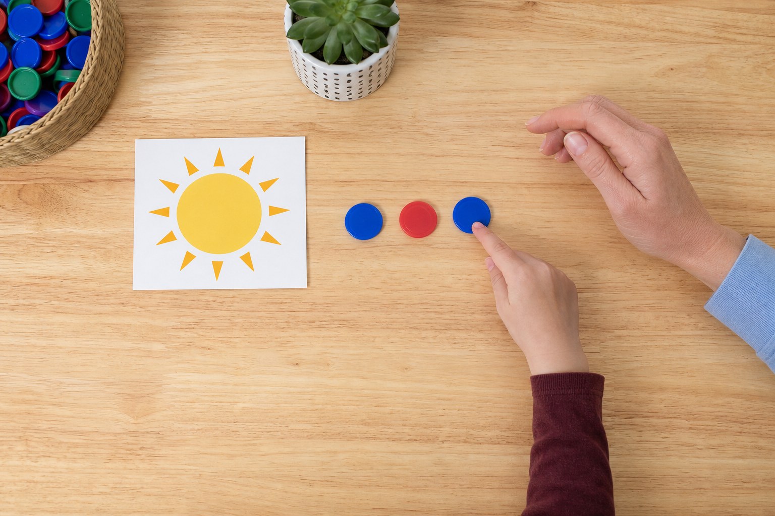 Child and adult using counters for a spoken sound game
