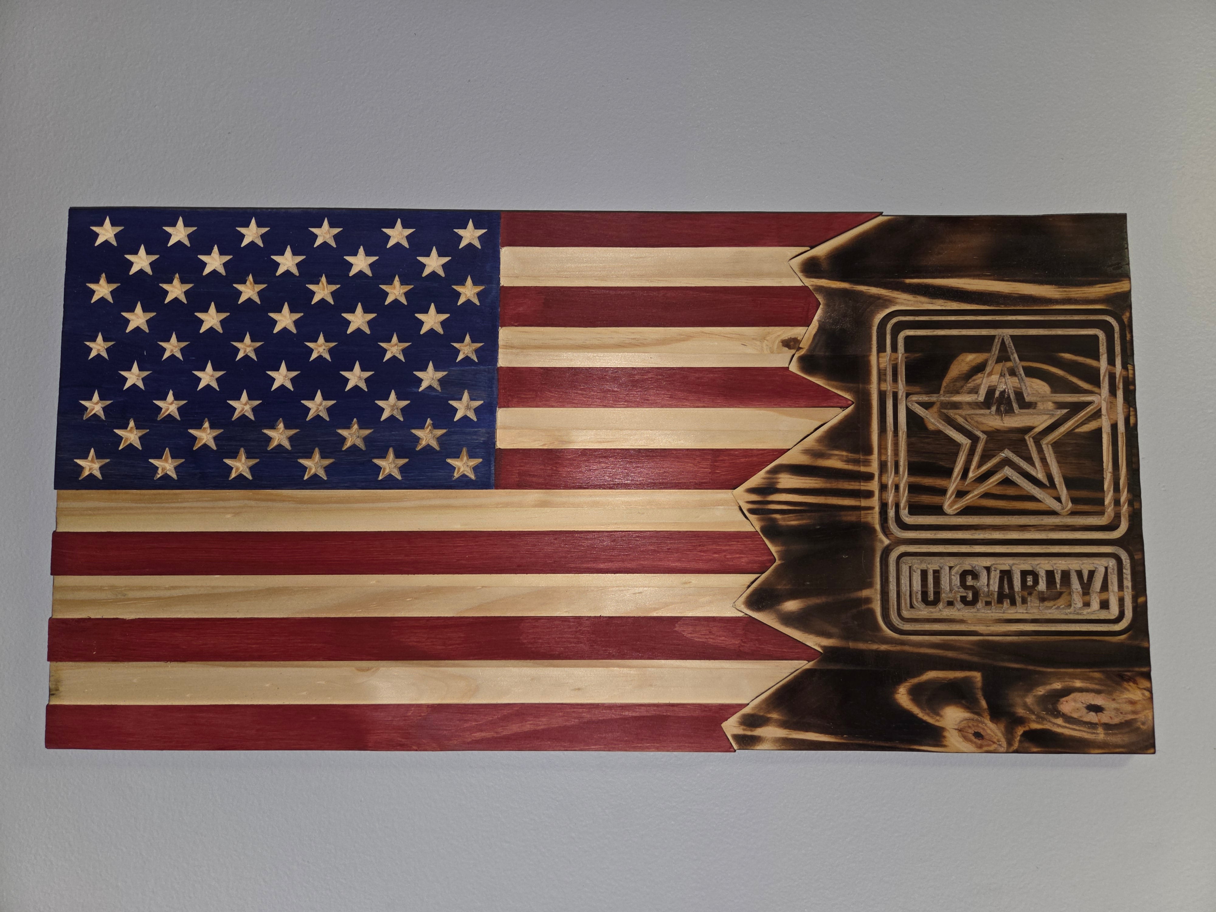 Close detail of a carved Army tribute wooden flag